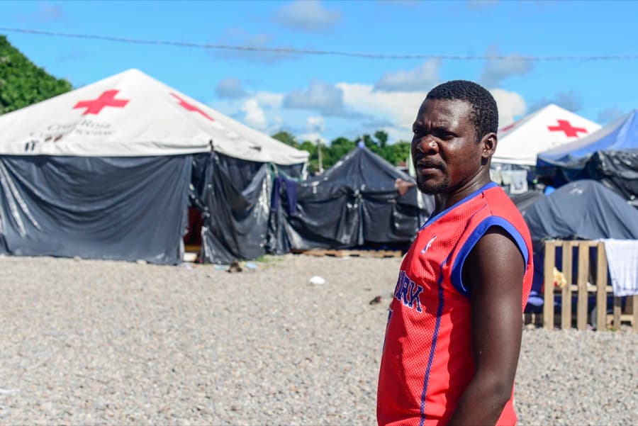 A migrant stands in a makeshift camp set up by the Red Cross in Paso Canoas, near Costa Rica's border with Panama.