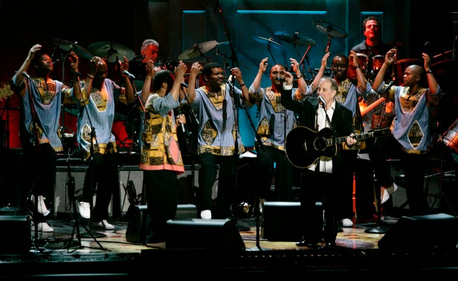 Paul Simon, front right, performed with members of Ladysmith Black Mambazo for the first time in several years during a tribute at the Warner Theater in Washington on May 23, 2007.