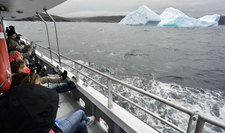 One of the icebergs near Cape Spear, Newfoundland, that attracts early tourists to Canada's most eastern province. Icebergs break off glaciers in Greenland and Baffin Bay and drift south to the Grand Banks along a route known as Iceberg Alley.