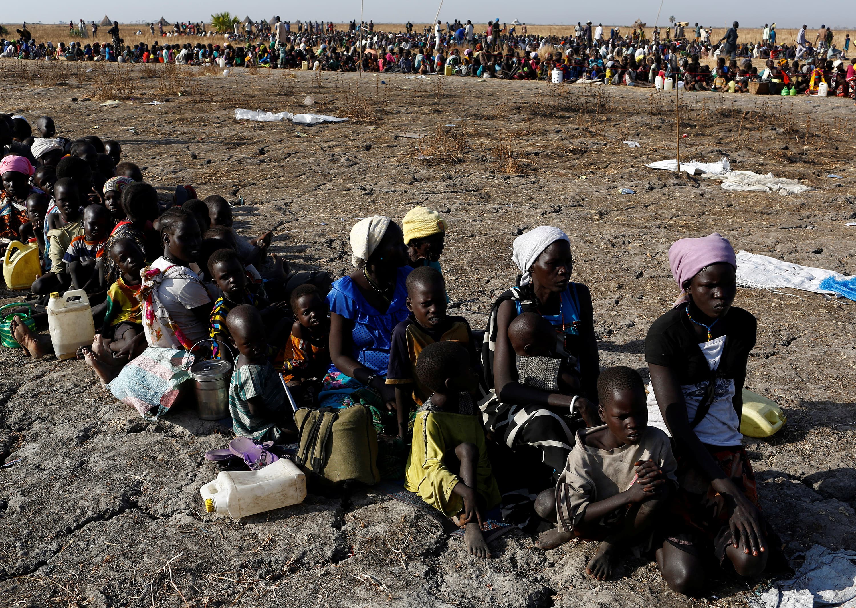 Women and children wait to be registered for food distribution by the UN World Food Program in Thonyor, South Sudan, Feb. 26, 2017.