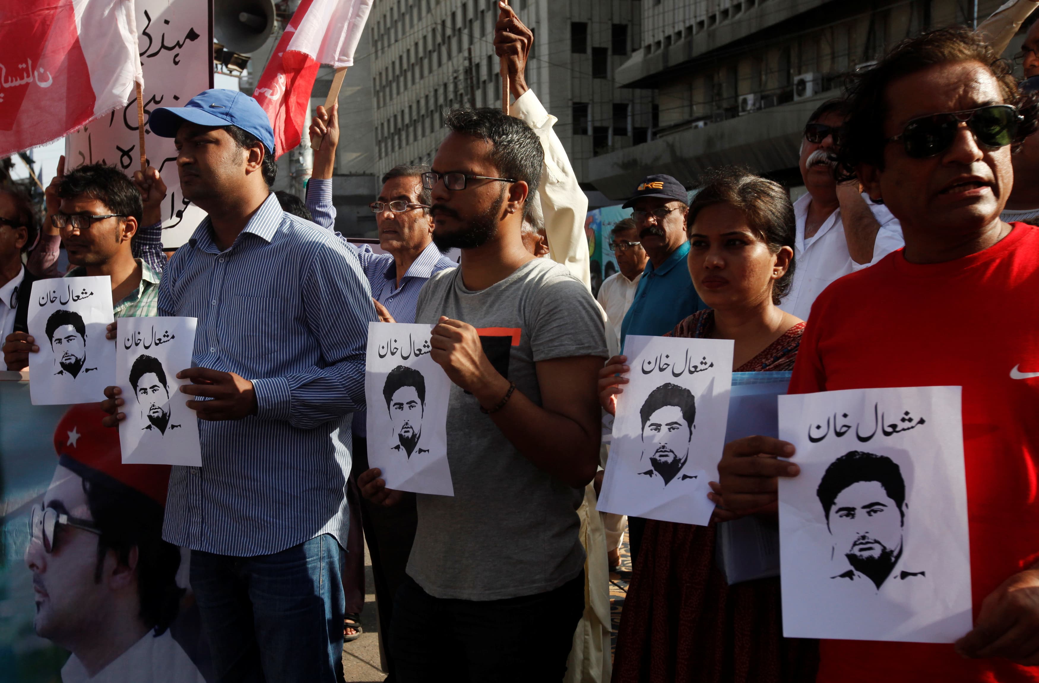 Members of the Awami Workers Party hold pictures with the name of student Mashal Khan during a demonstration in Karachi, Pakistan, April 18, 2017.