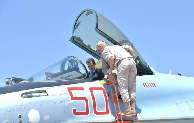 Syria's President Assad sitting in a Russian fighter plane, during a visit to a Russian air base, Tuesday June 27th 2017