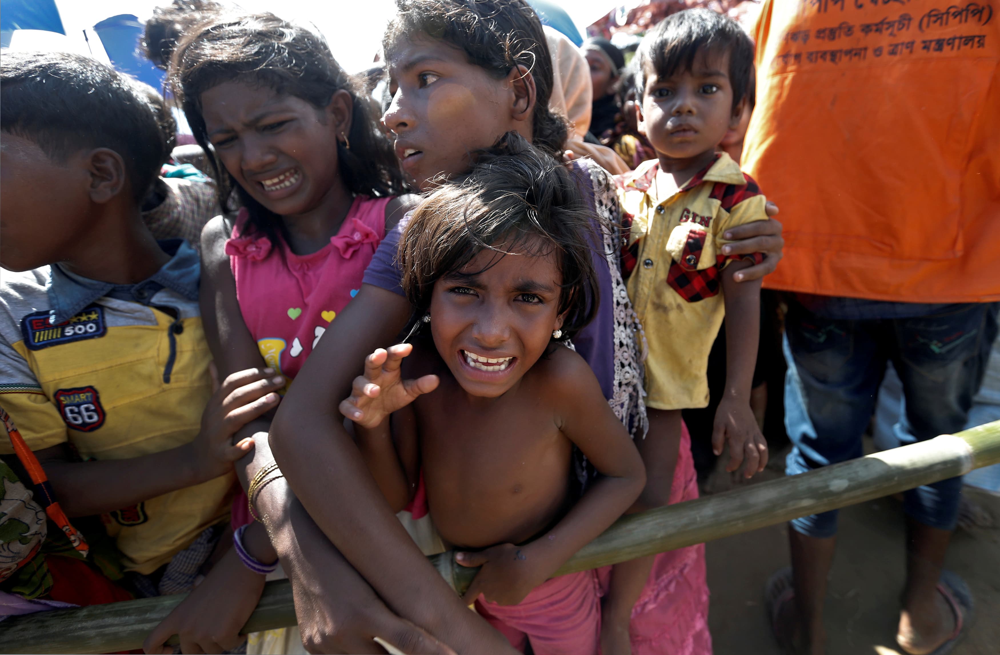 Rohingya refugees wait to receive aid in Cox's Bazar, Bangladesh, Sept. 25, 2017.