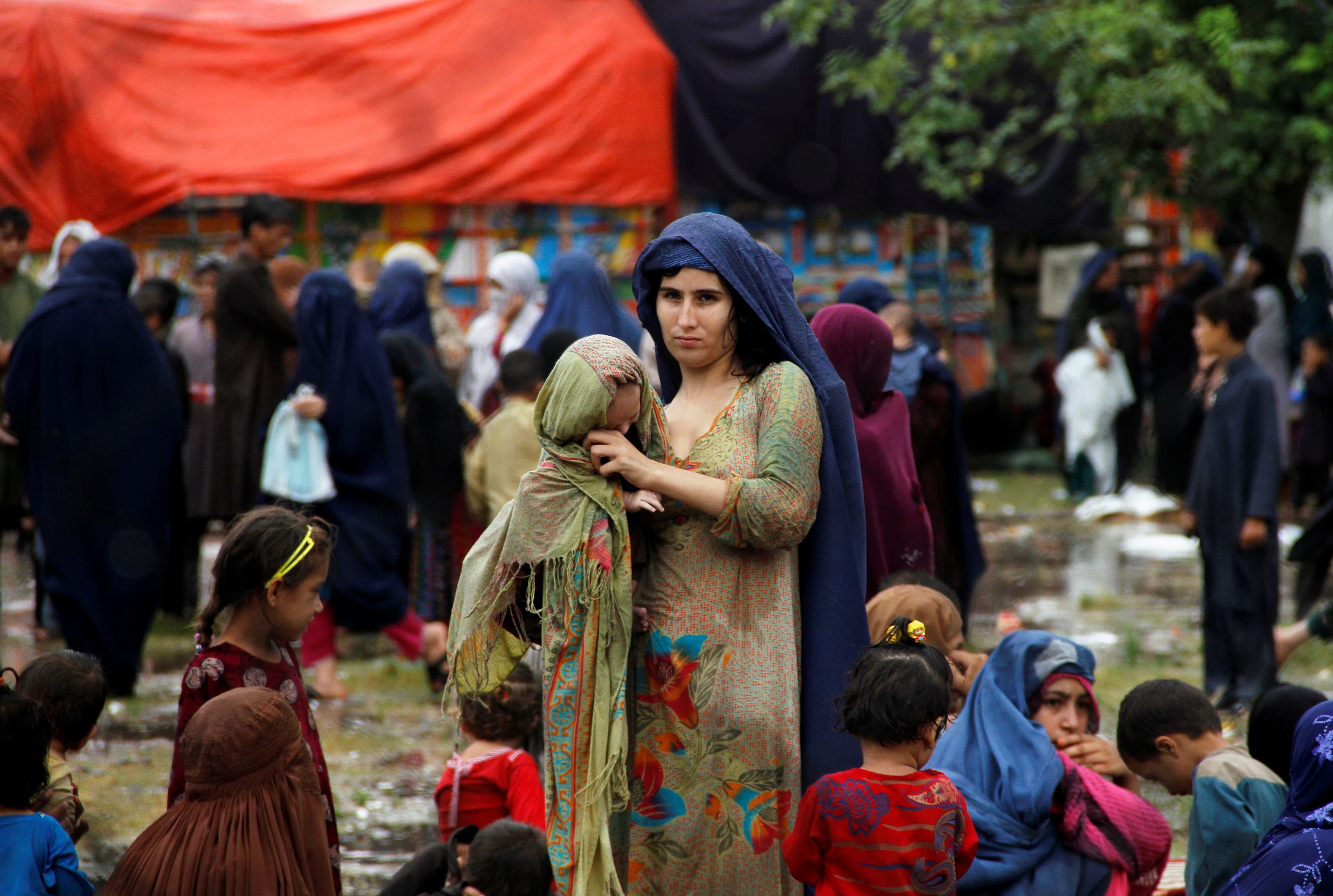 Families prepare to return to Afghanistan, at a UN refugee repatriation center in Peshawar, Pakistan, Aug. 2, 2016.