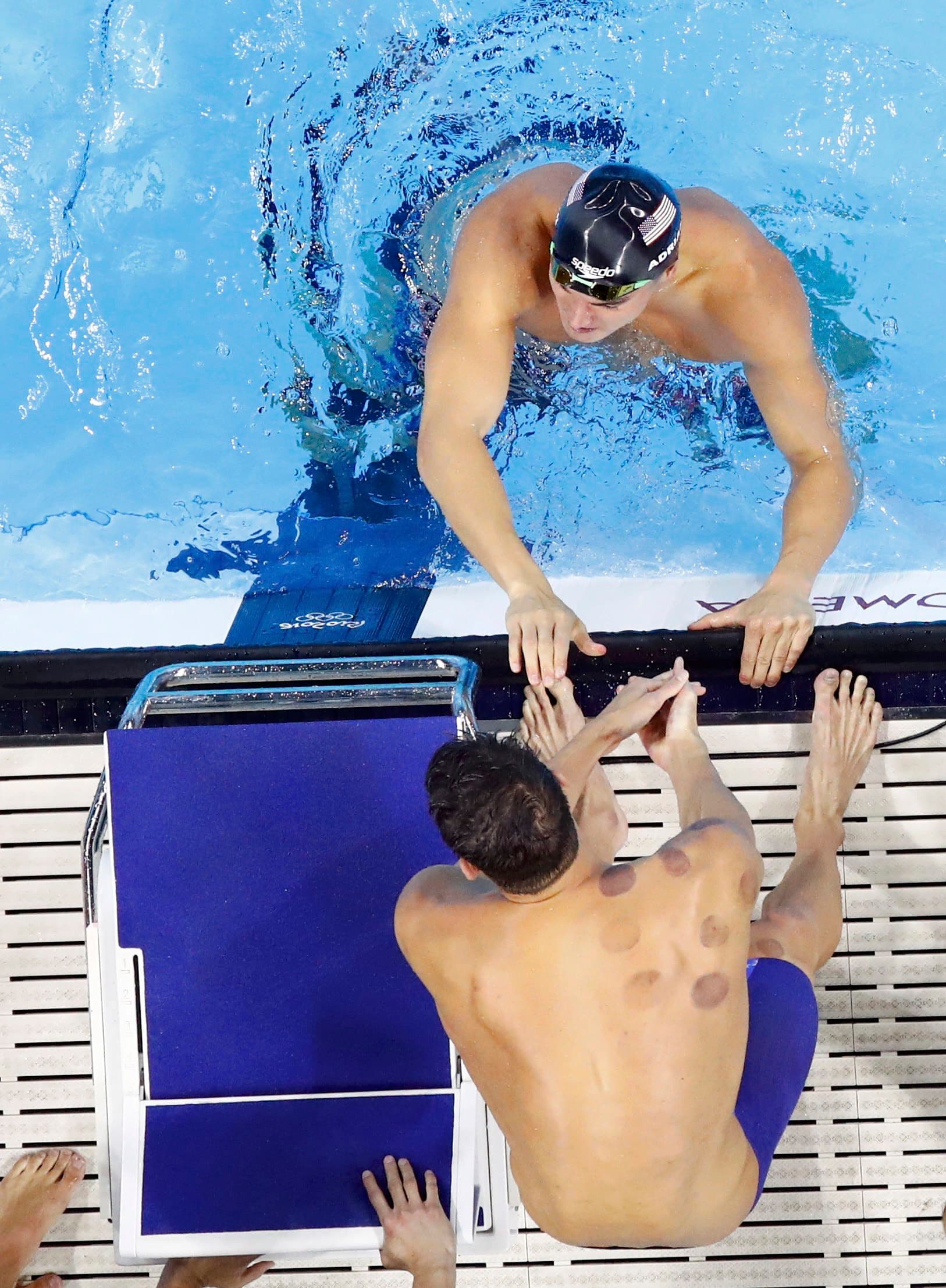 2016 Rio Olympics - Swimming - Final - Men's 4 x 100m Freestyle Relay Final - Olympic Aquatics Stadium - Rio de Janeiro, Brazil - 07/08/2016. Michael Phelps (USA) of USA congratulates teammate Nathan Adrian (USA) after they won. REUTERS/Athit Perawongmeth