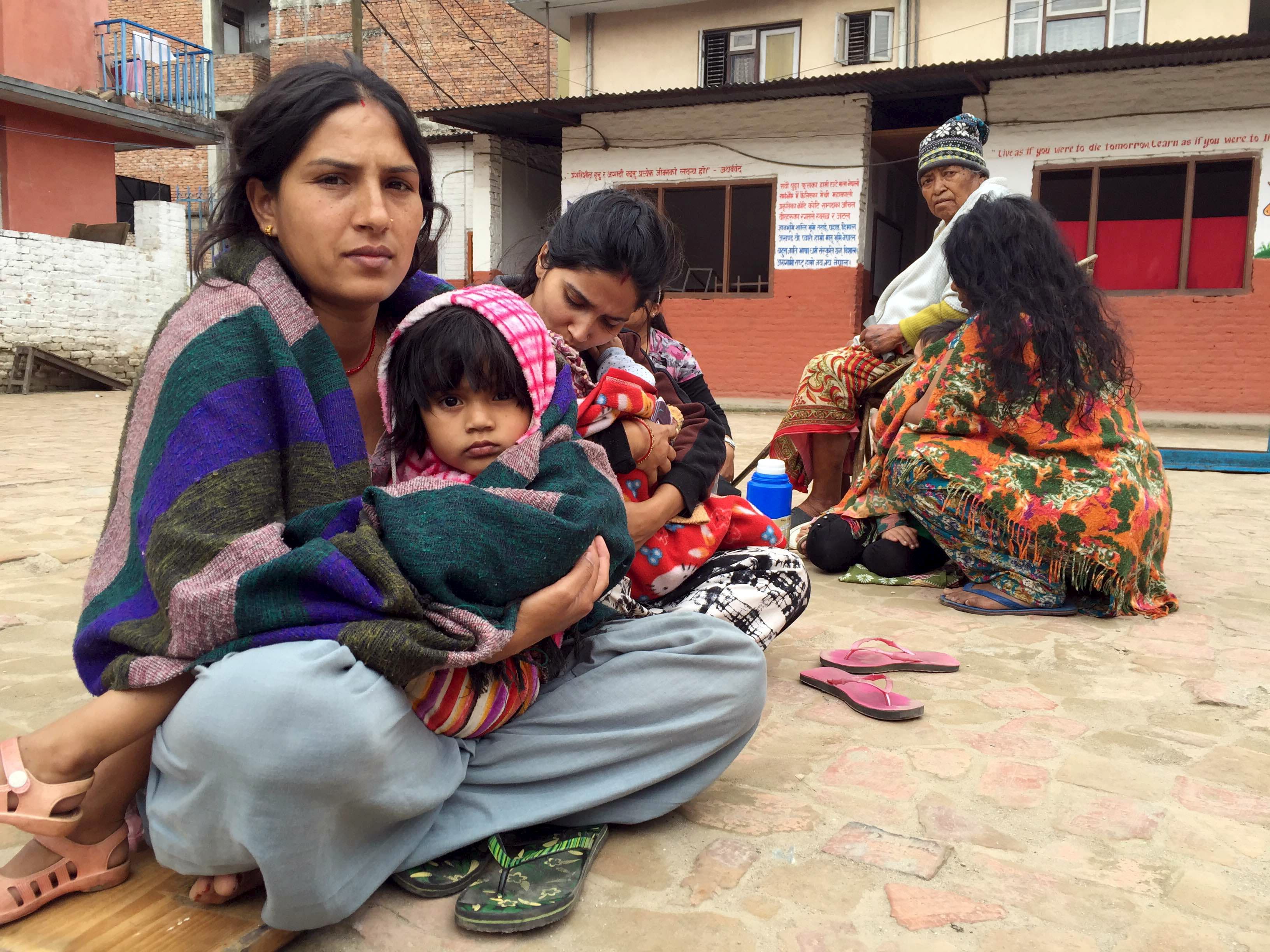 Survivors take shelter in a school