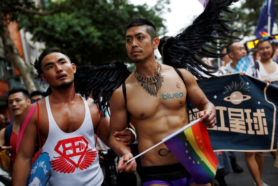 A participant holds a rainbow flag as he takes part in the lesbian, gay, bisexual and transgender pride parade in Taipei, Taiwan on Oct. 29.