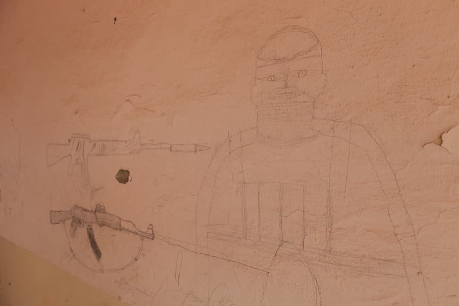 A drawing left by ISIS militants adorns the wall of a school after Iraqi forces recaptured Qayyarah, Iraq, on Nov. 17.