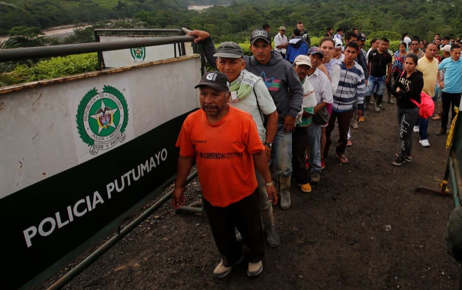 People wait to recognize the bodies of their relatives in the cemetery in Mocoa, Colombia on April 2.
