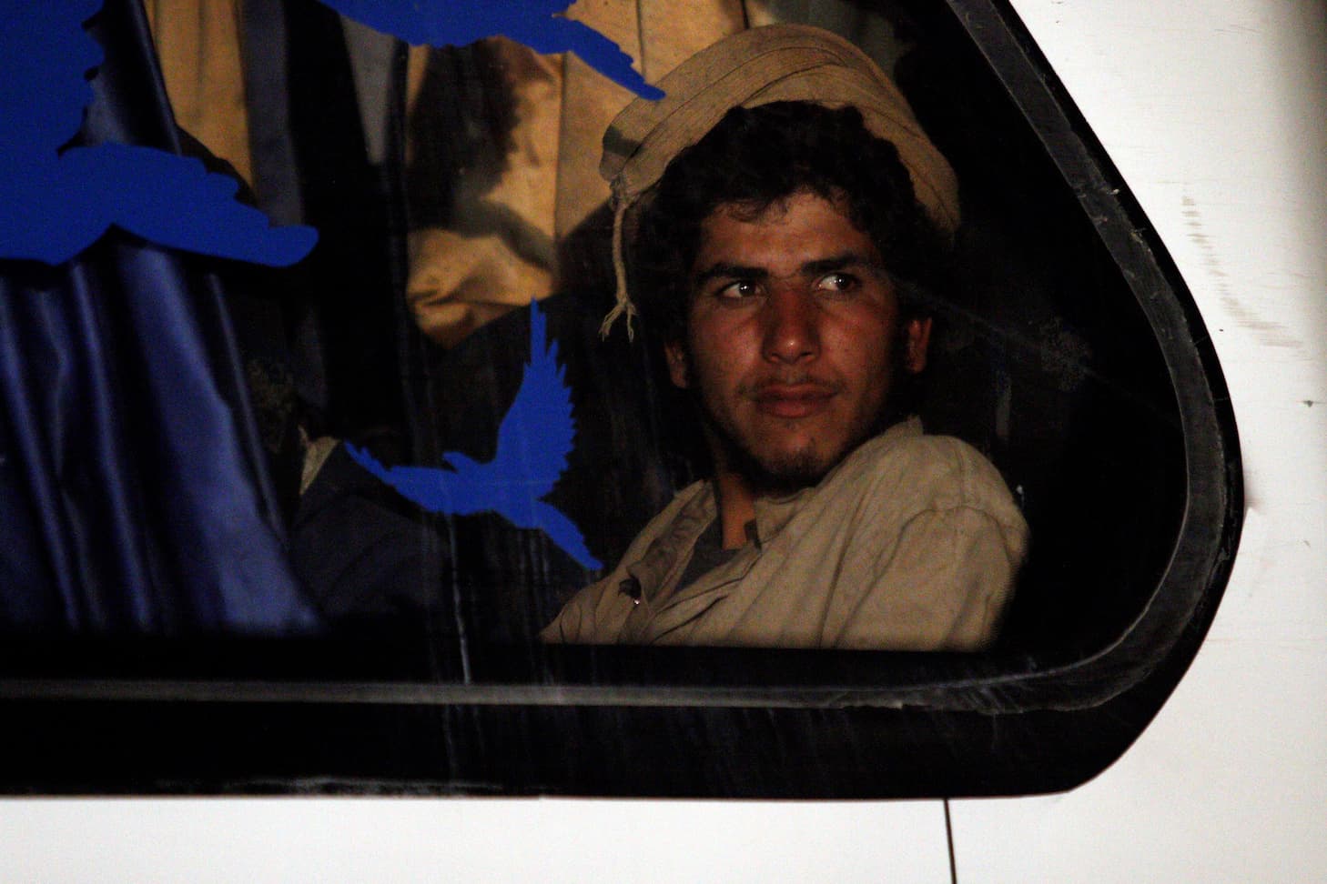 An ISIS fighter in a bus departing from the Lebanon-Syria border zone on Aug. 28, 2017.