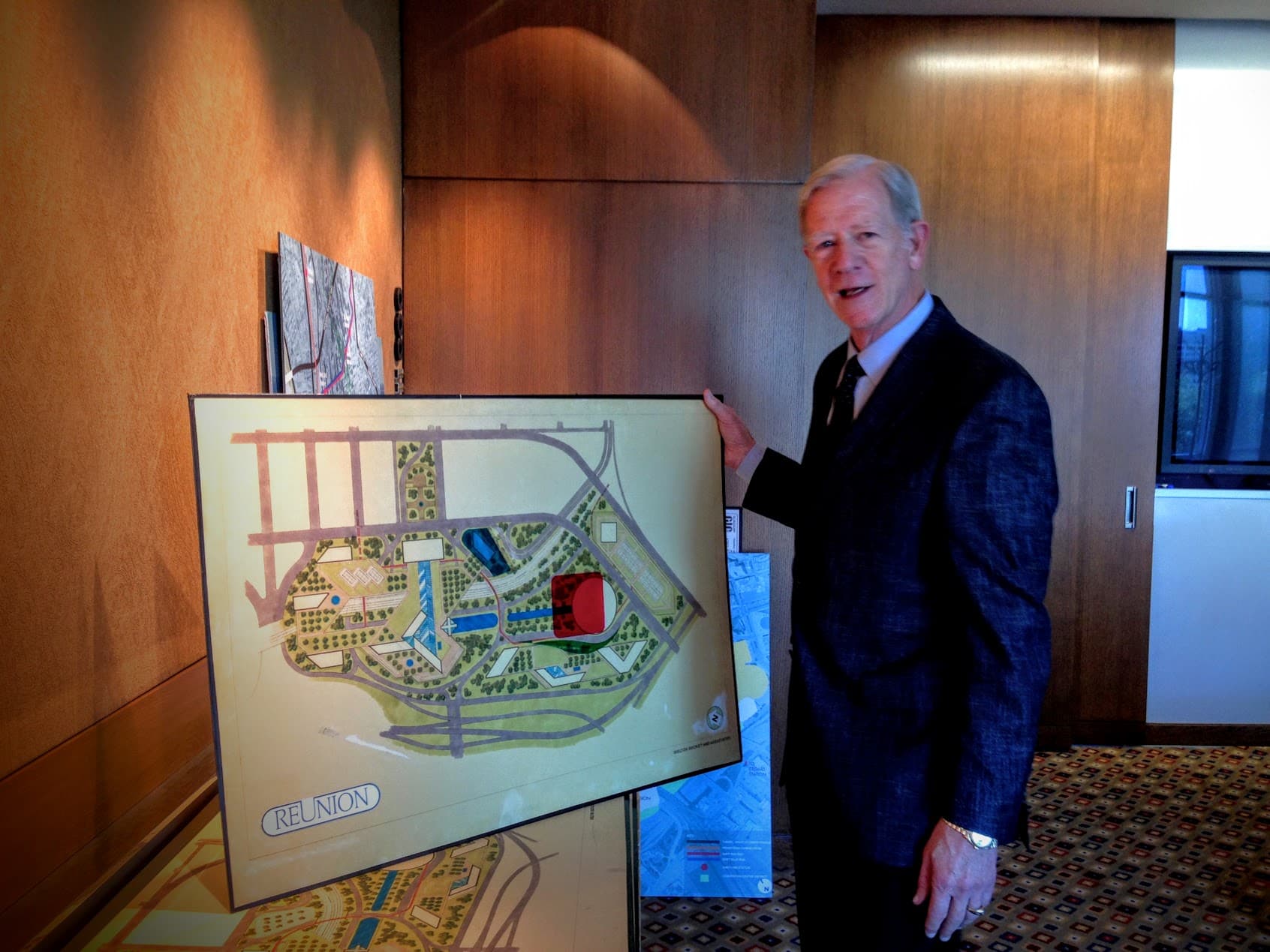 John Scovell, President and CEO of Woodbine Development Corporation in Dallas, shows off the original plan for the parcel of land he named after the La Réunion colony.