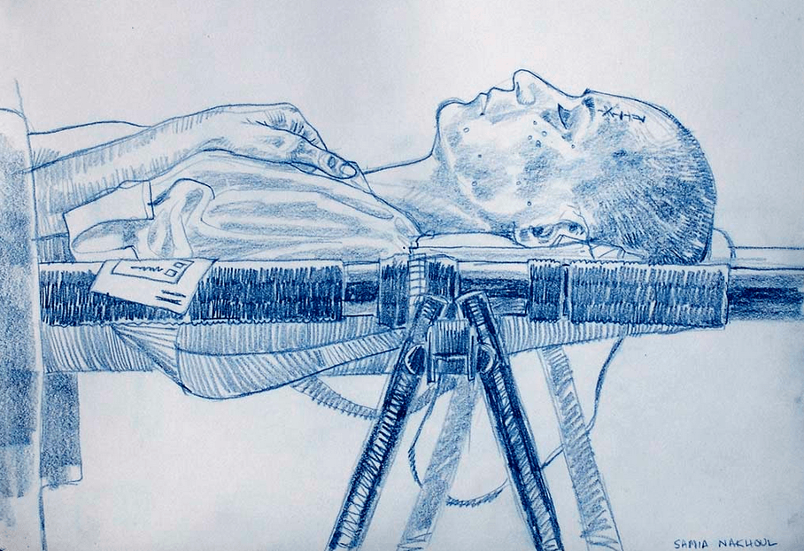 Journalist Samia Nakhoul in a MASH unit in Camp Chesty, Iraq. Samia and a fellow journalist had been residents in the Palestine Hotel when it was struck with a tank round. March 2003.