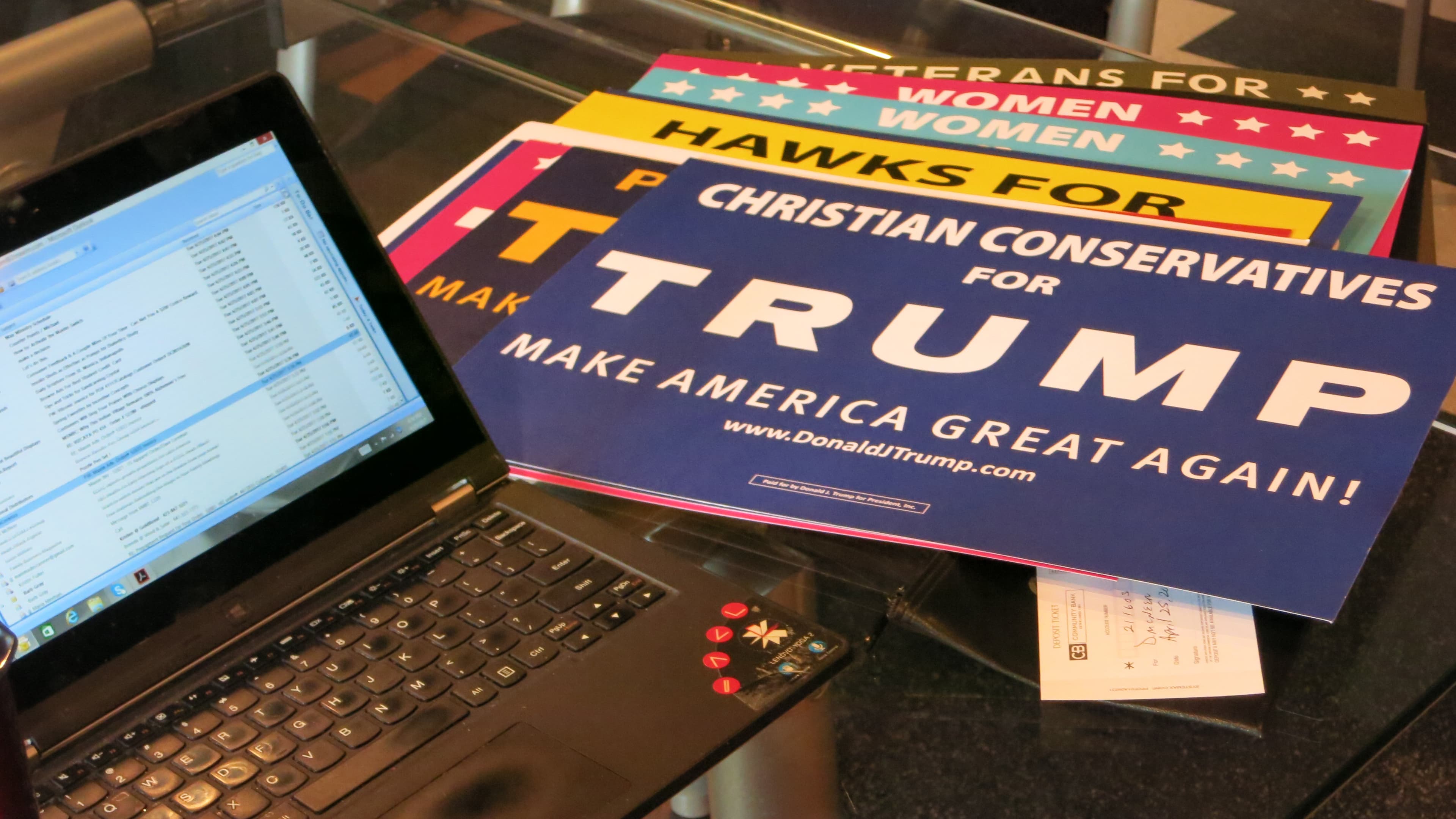 Campaign signs targeting different groups in Dave McNeer's office in Newton, Iowa.