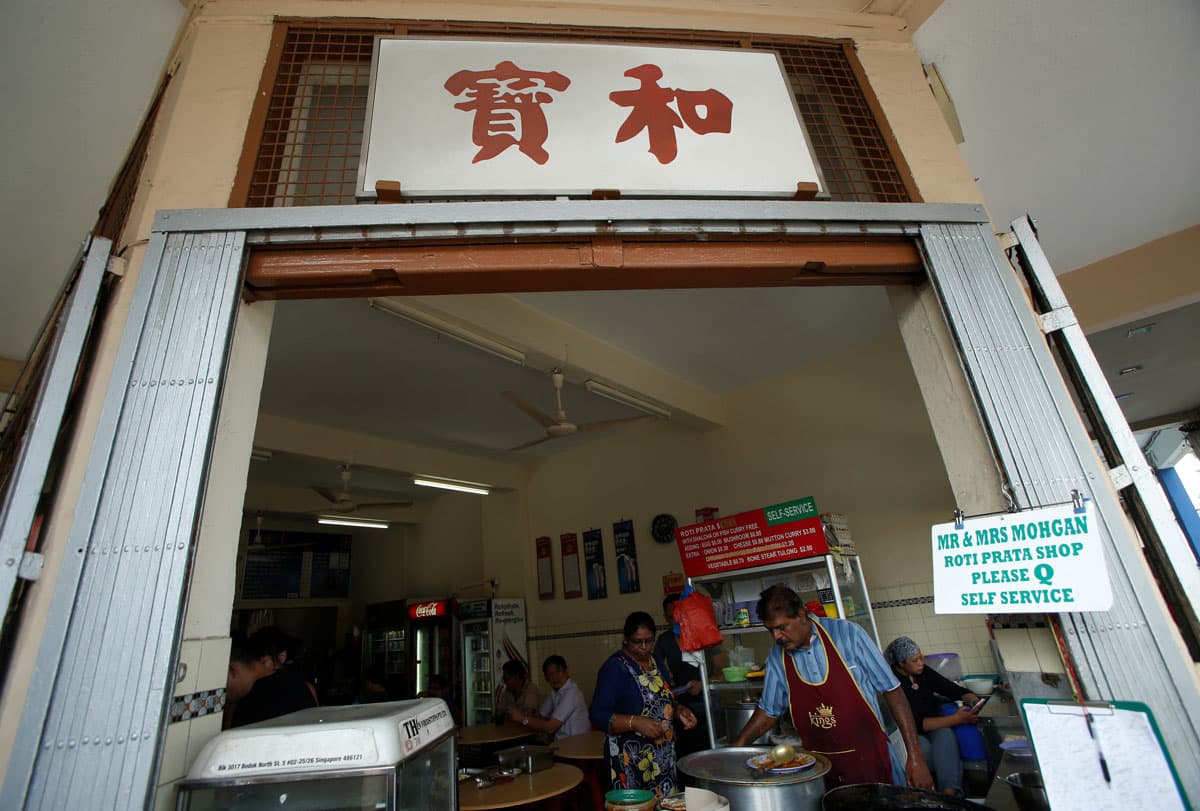 Sumosundram Moghan at his stall in Singapore.