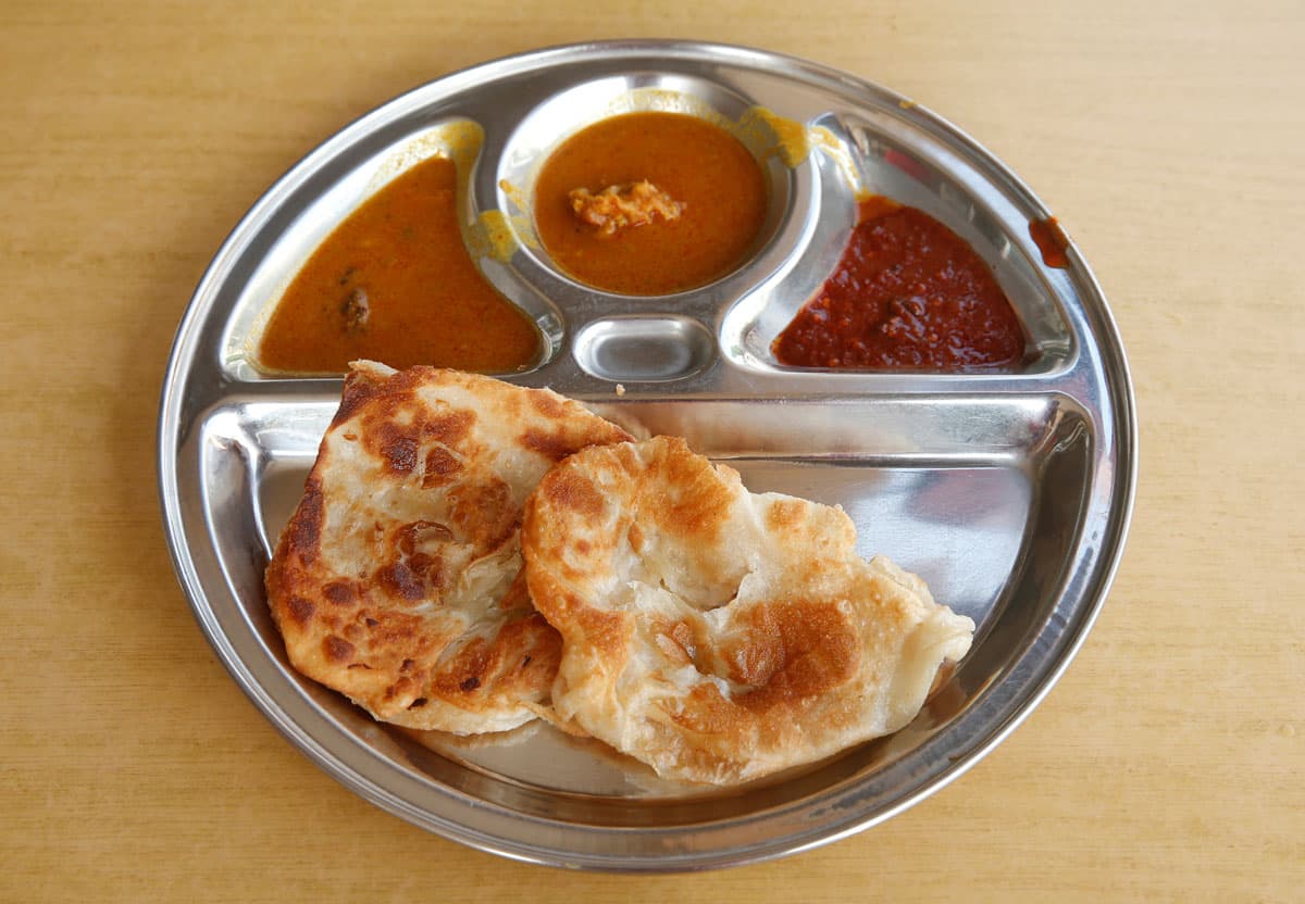 A plate of roti prata, costing $1.50.