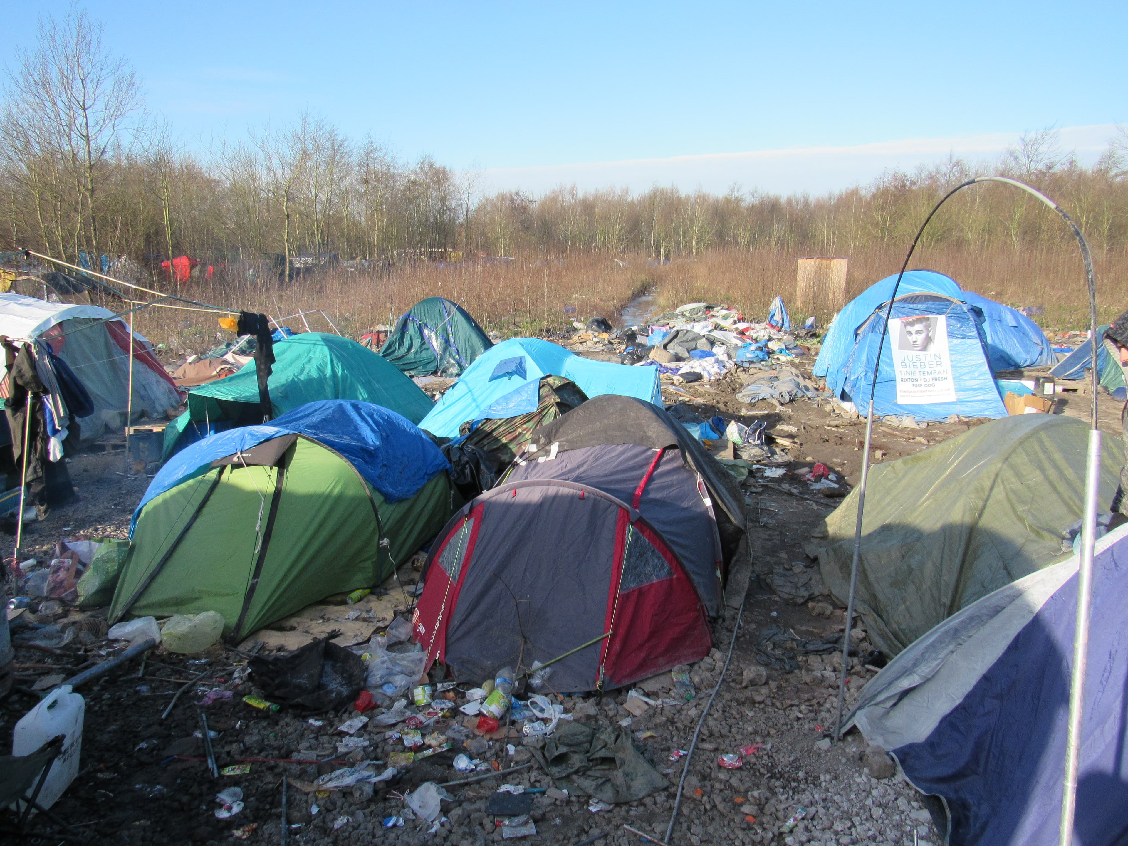 Tents and trash thrown together