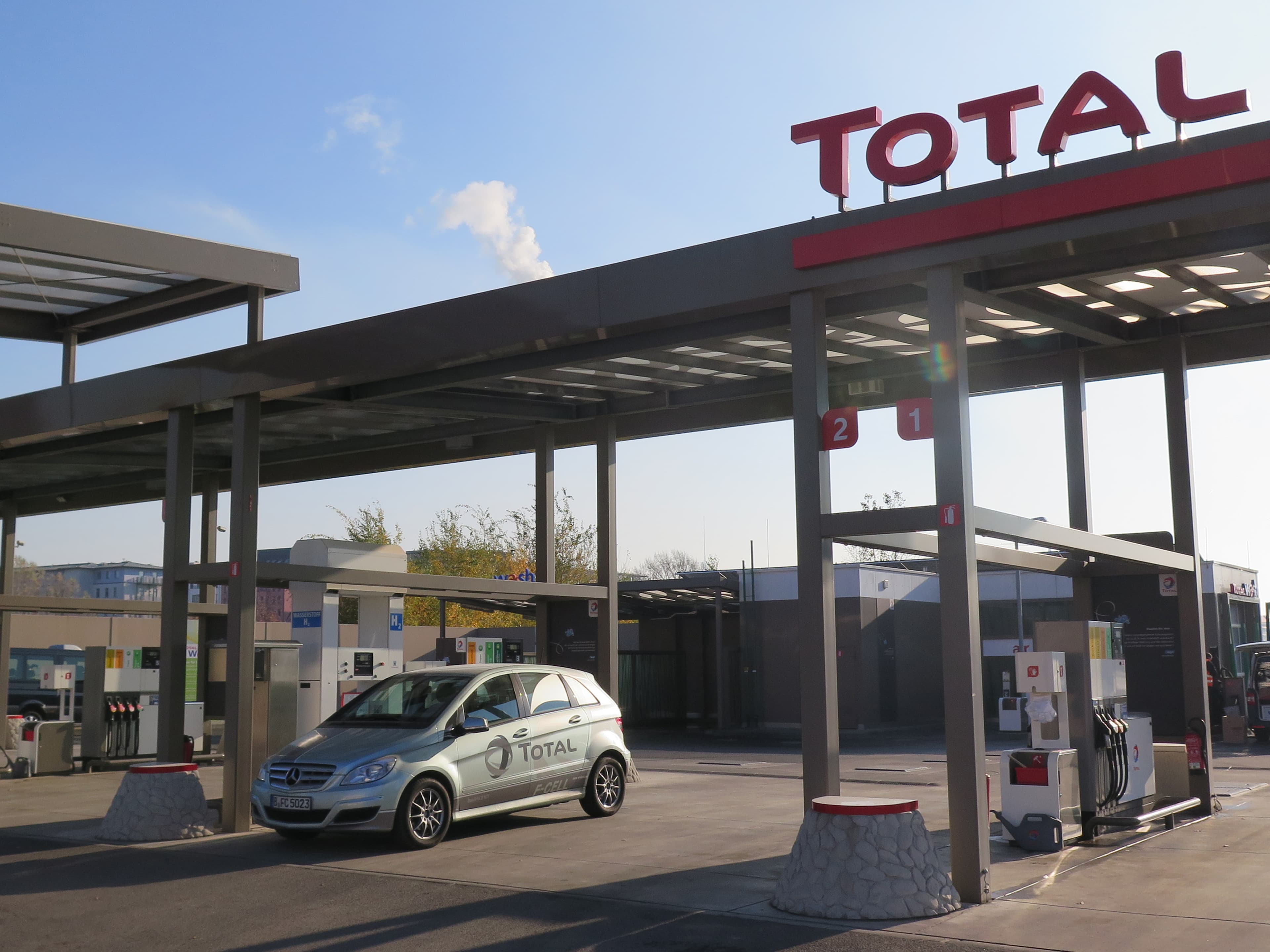 A fuel cell-powered Mercedes at a filling station on the edge of downtown Berlin. The station is part of a small but growing hydrogen infrastructure in Germany. Hydrogen generated by wind-power is cirtually carbon-free, and can be used to regenerate elect