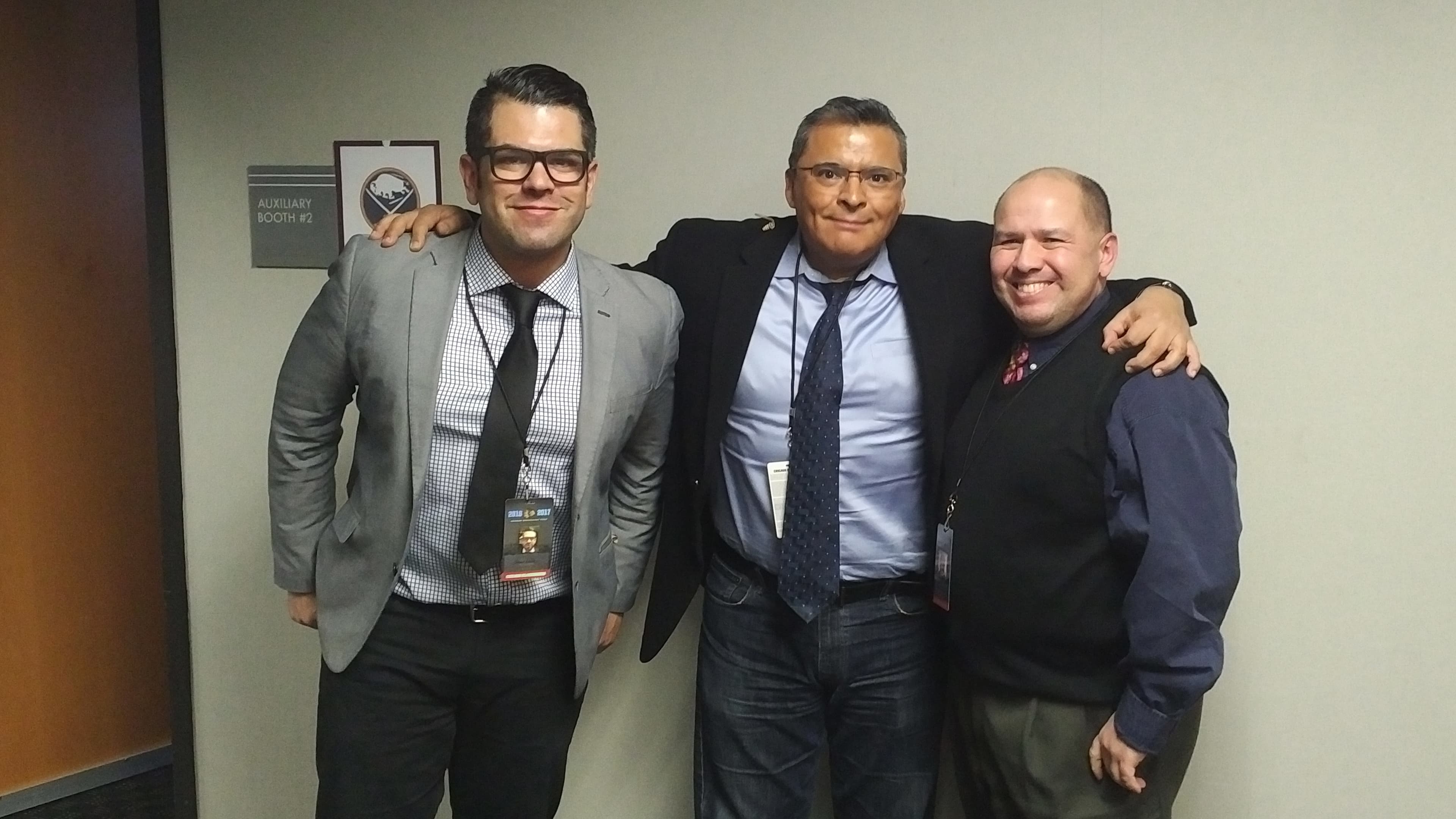 Three men in hallway