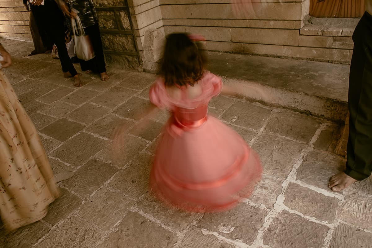 A Yazidi child is excited to great her mother.