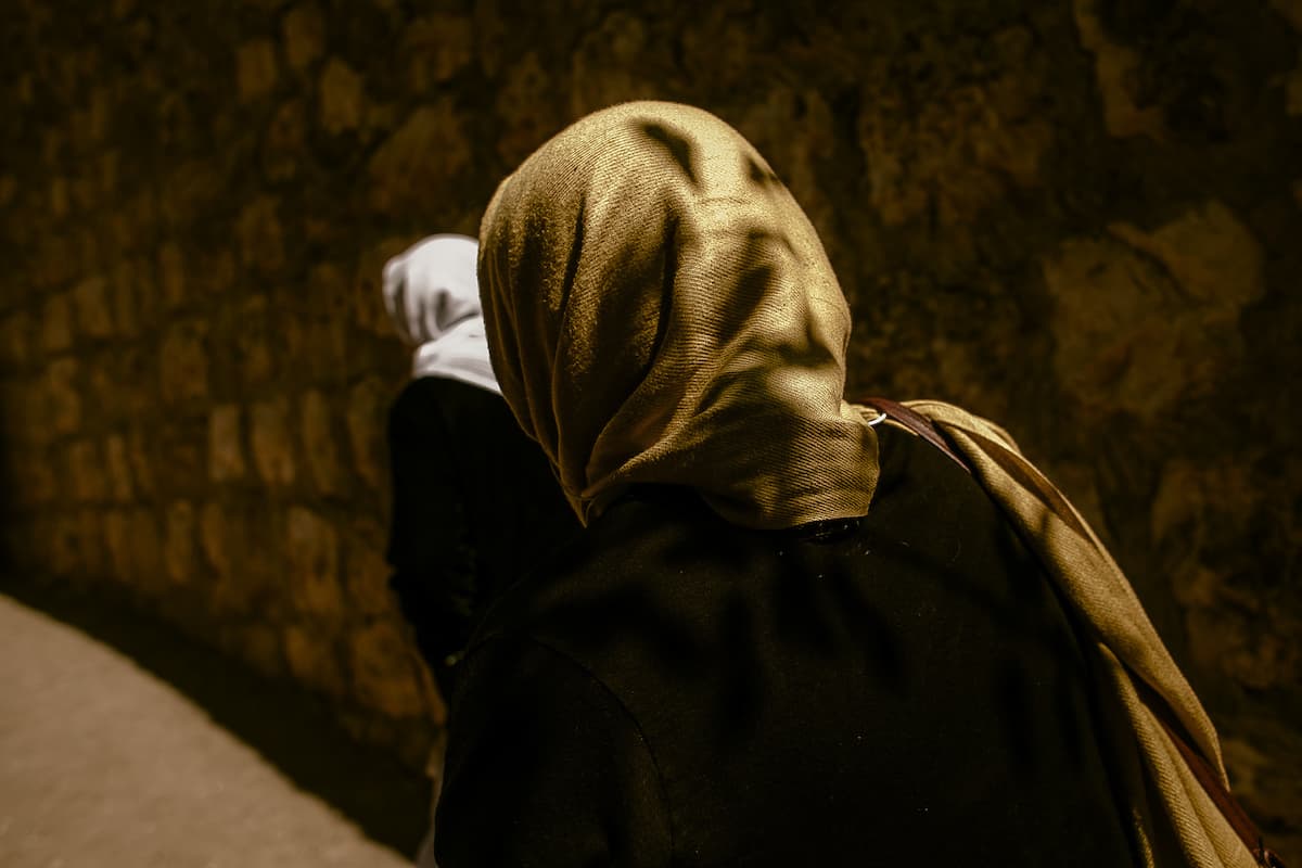 The women leave the ceremony area, now recognized as Yazidis once more.