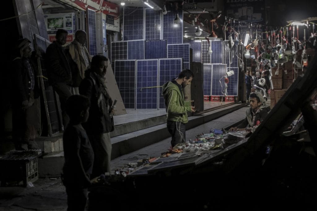 The electric grid in Sanaa, Yemen’s capital city, has been dead for months. As a result, Yemenis have become experts in wattage. Here, solar panels are sold at the market. For those that can afford them, they’ll help with the lights. But they won’t power