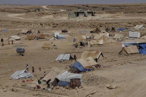 The northern side of a camp for displaced people in Amran. About 30 families are sharing a single water tank here.