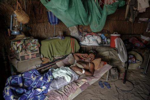 Mohamed Suleiman lies convalescing in a hut in his home village near Beit al-Faqih in Hudeidah province. His spine was partially broken when coalition warplanes targeted the fishing boat he was sleeping in on Oct. 22. At least 42 were killed in the attack