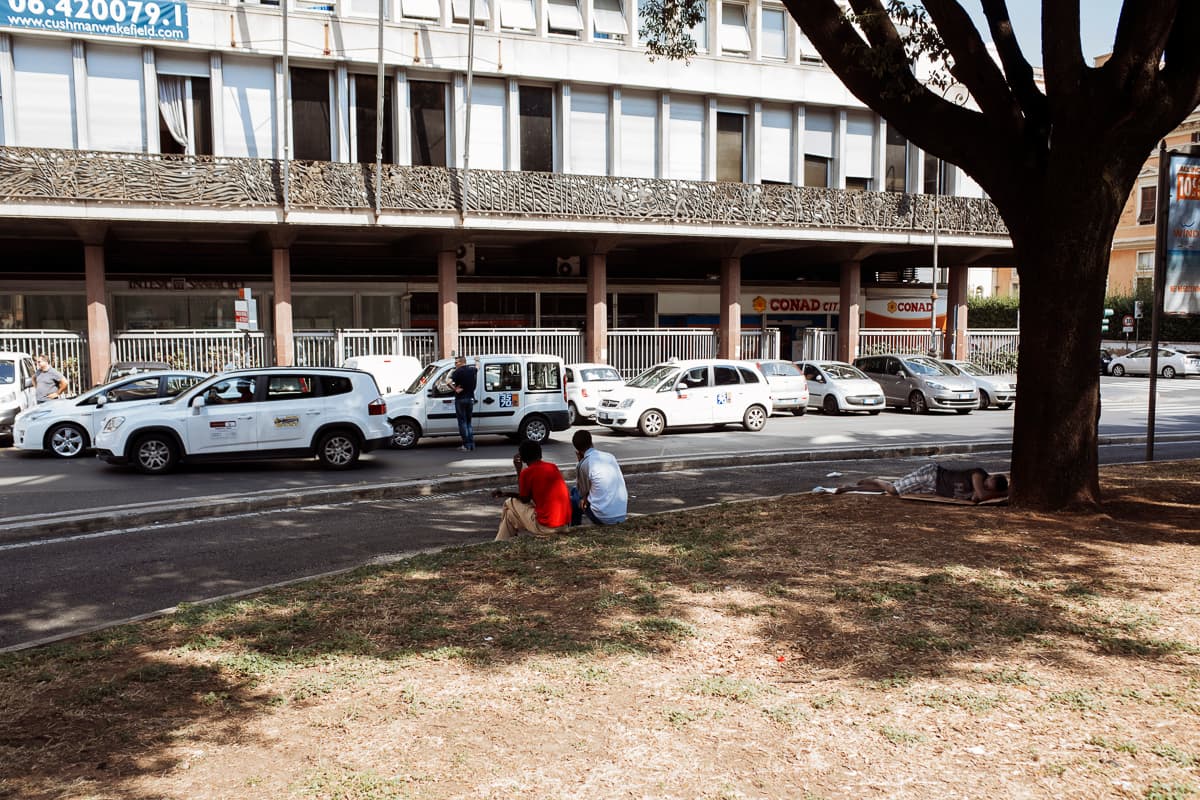 Young men outside a squat that houses roughly 600 migrants from Eritrea, Ethiopia and Sudan.
