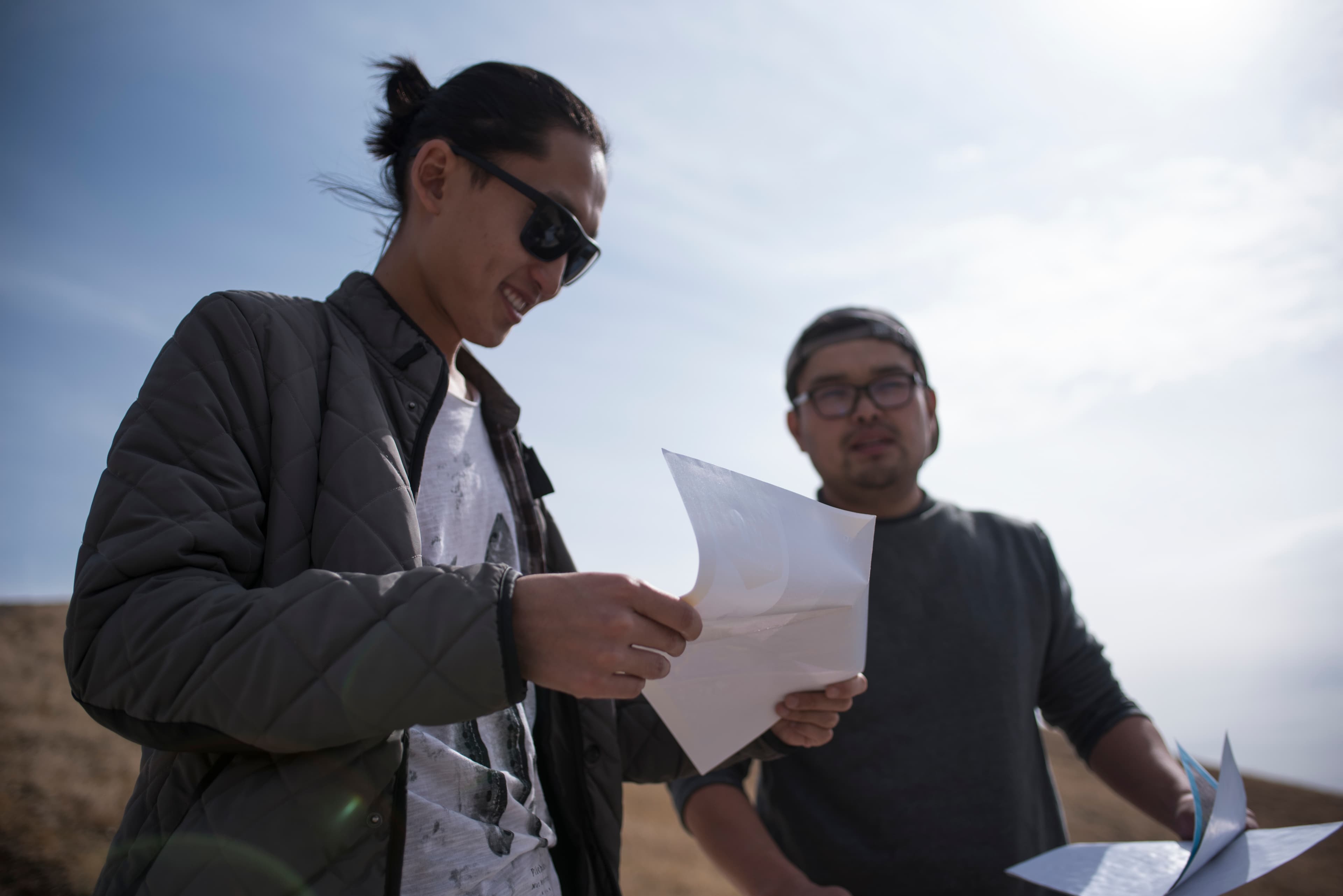 Activists Tuguldur Chuluunbaatar, left, and Batdorj Gongor, right, map environmental and social conditions in the ger district to rally support for change. Photo by Shane Thomas McMillan