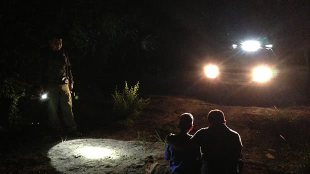 A grandson hugs his grandfather after both were apprehended by Border Patrol in Hidalgo, Texas. (Photo: Mónica Ortiz Uribe)