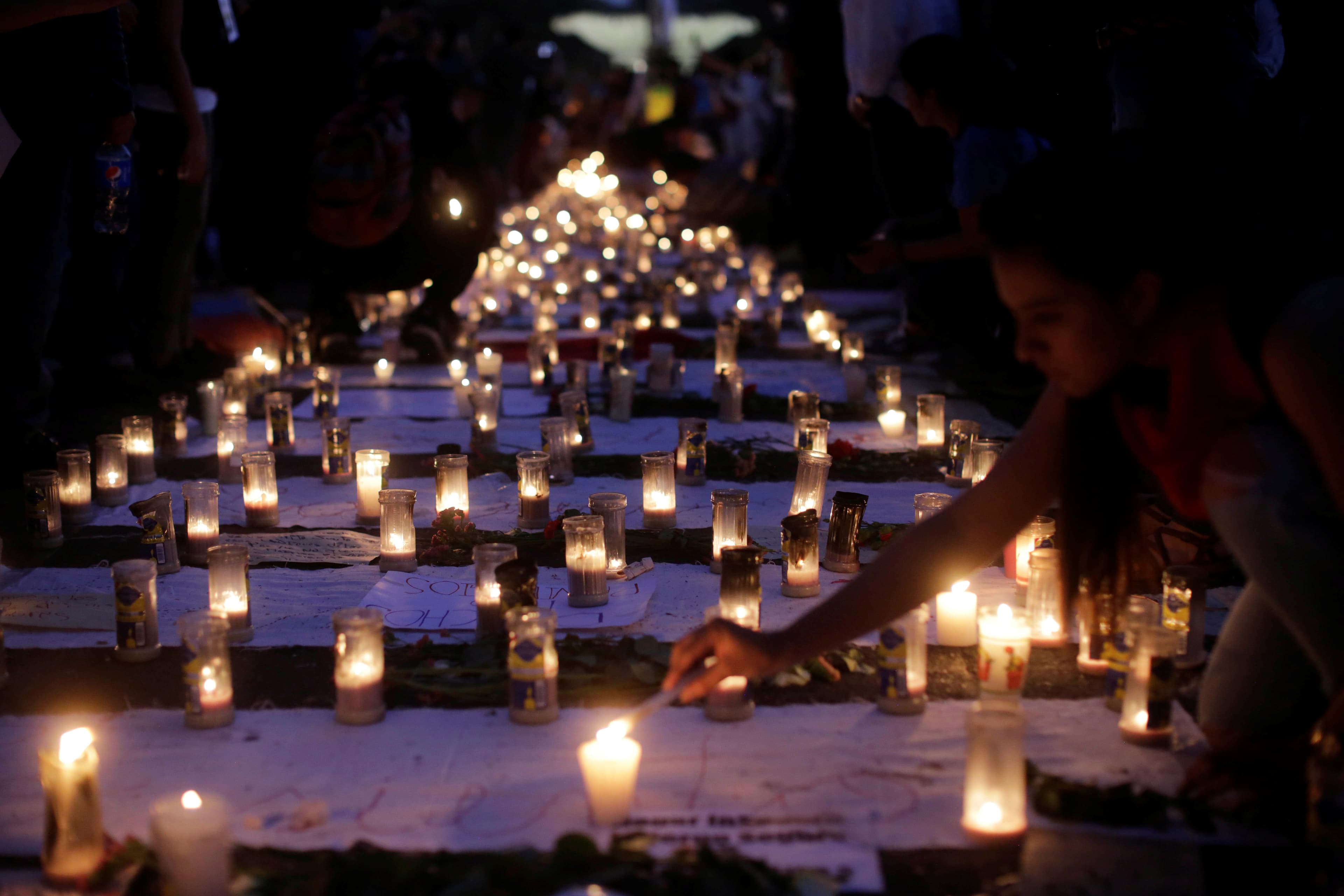 Candles are lit during a protest