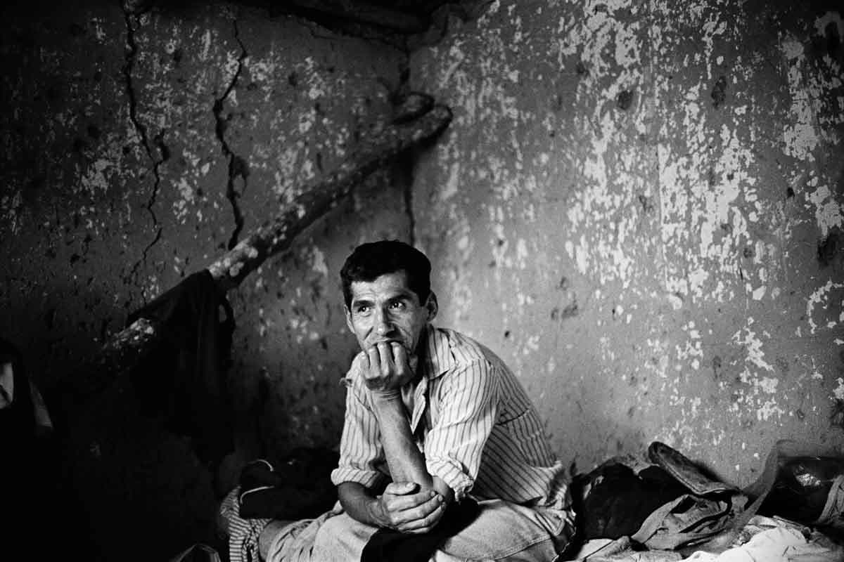 Carlos Pérez, a coca farmer from Los Yungas valley, takes a break from work in the field in a hundred year-old dwelling on his family's coca property near Chulumani.