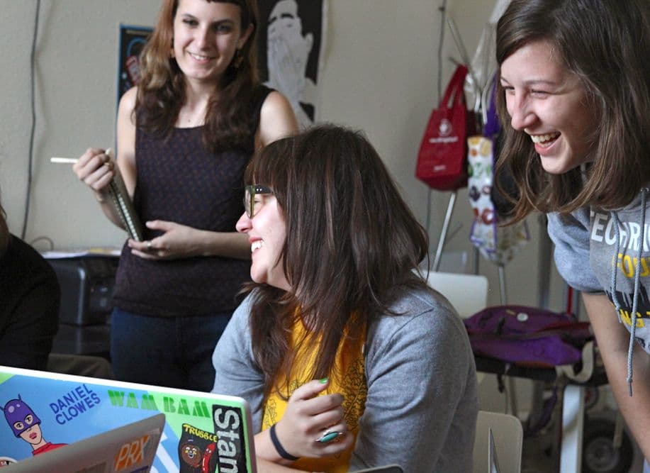 Pop Up Archive Co-founder Anne Wootton (right) shows off new features of the site to Ashleyanne Krigbaum (center).