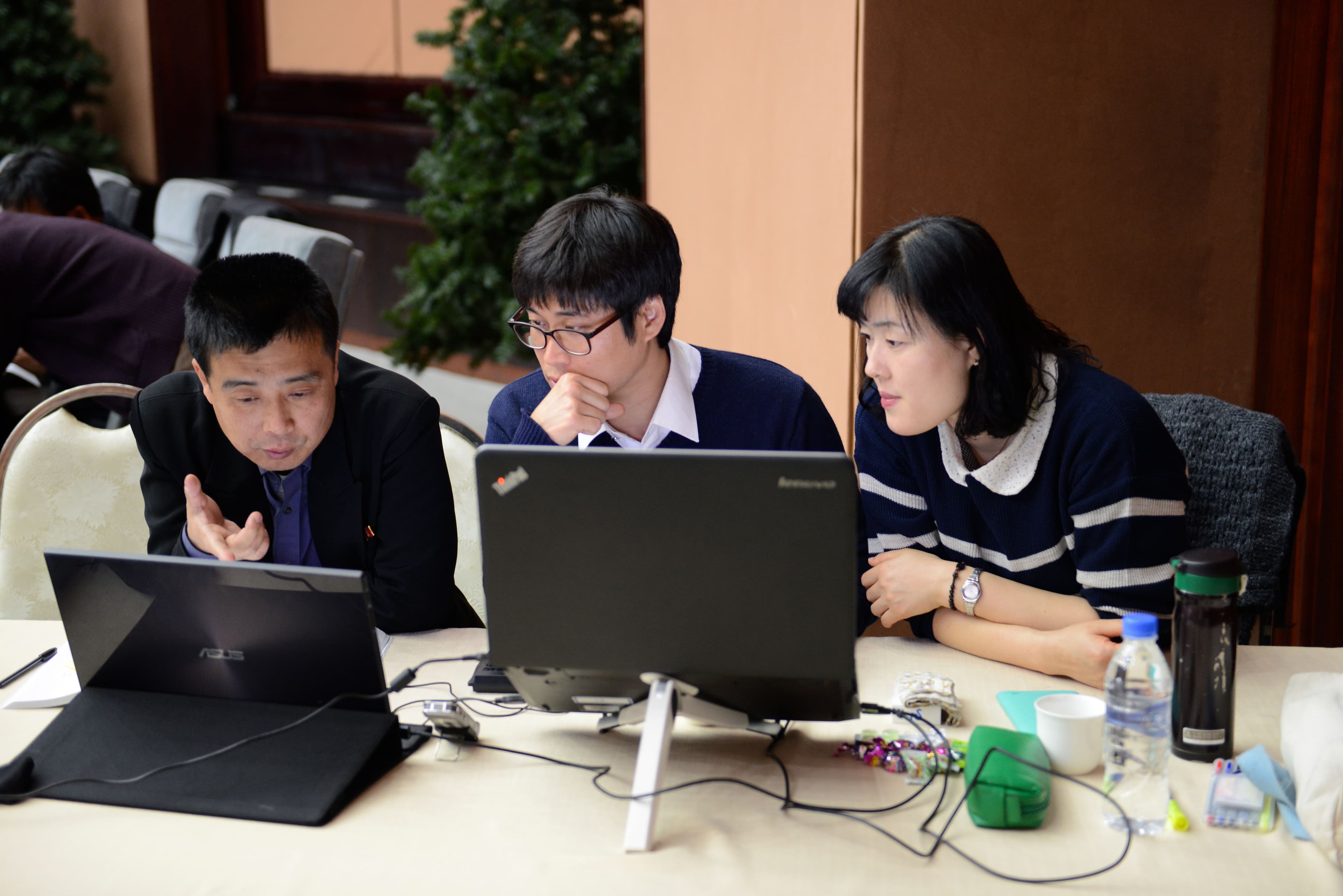 Editors confer at the offices of the unified Korean dictionary.