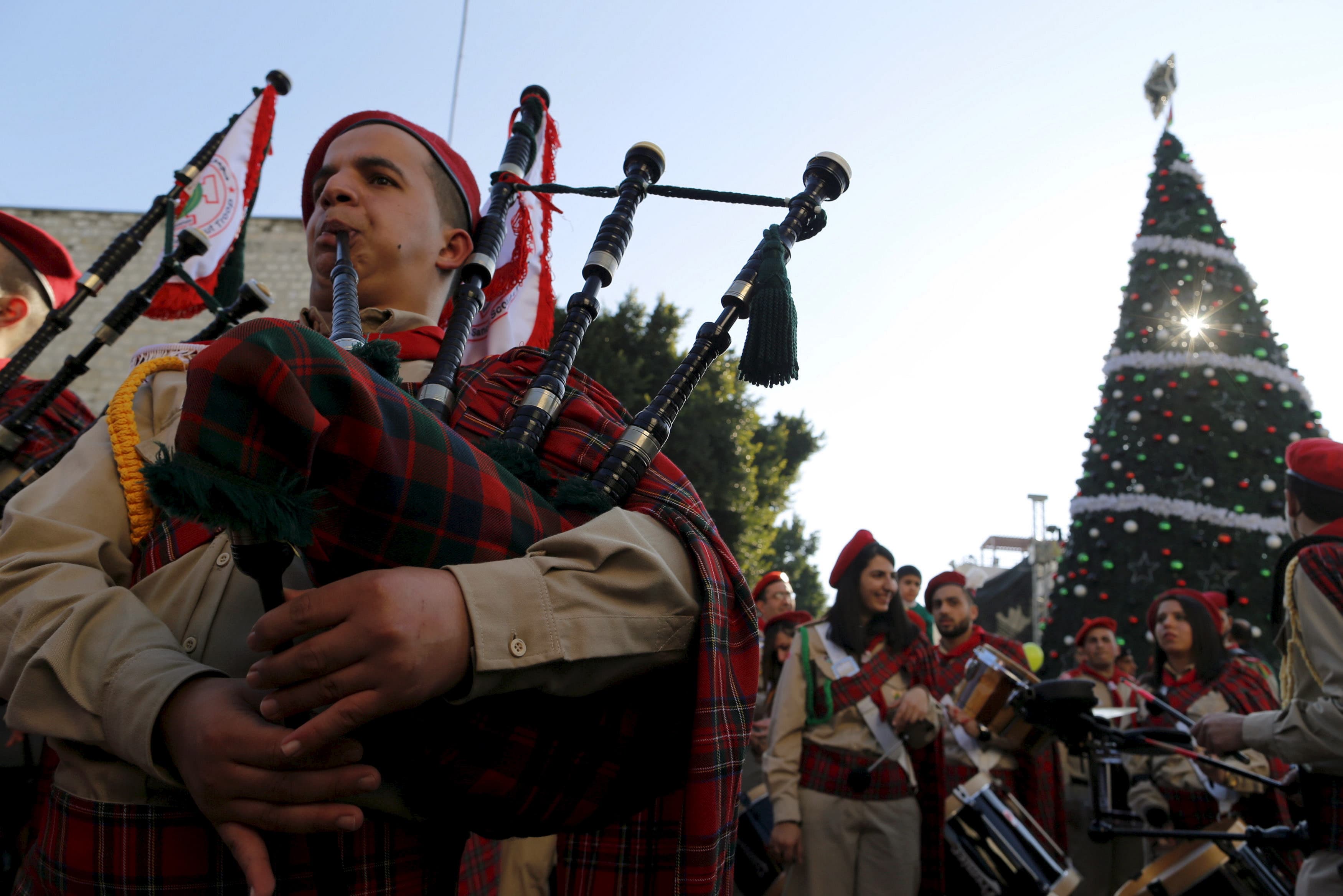 A Palestinian marching band parades during a Christmas procession at Manger Square in the West Bank city of Bethlehem Dec. 24, 2015.