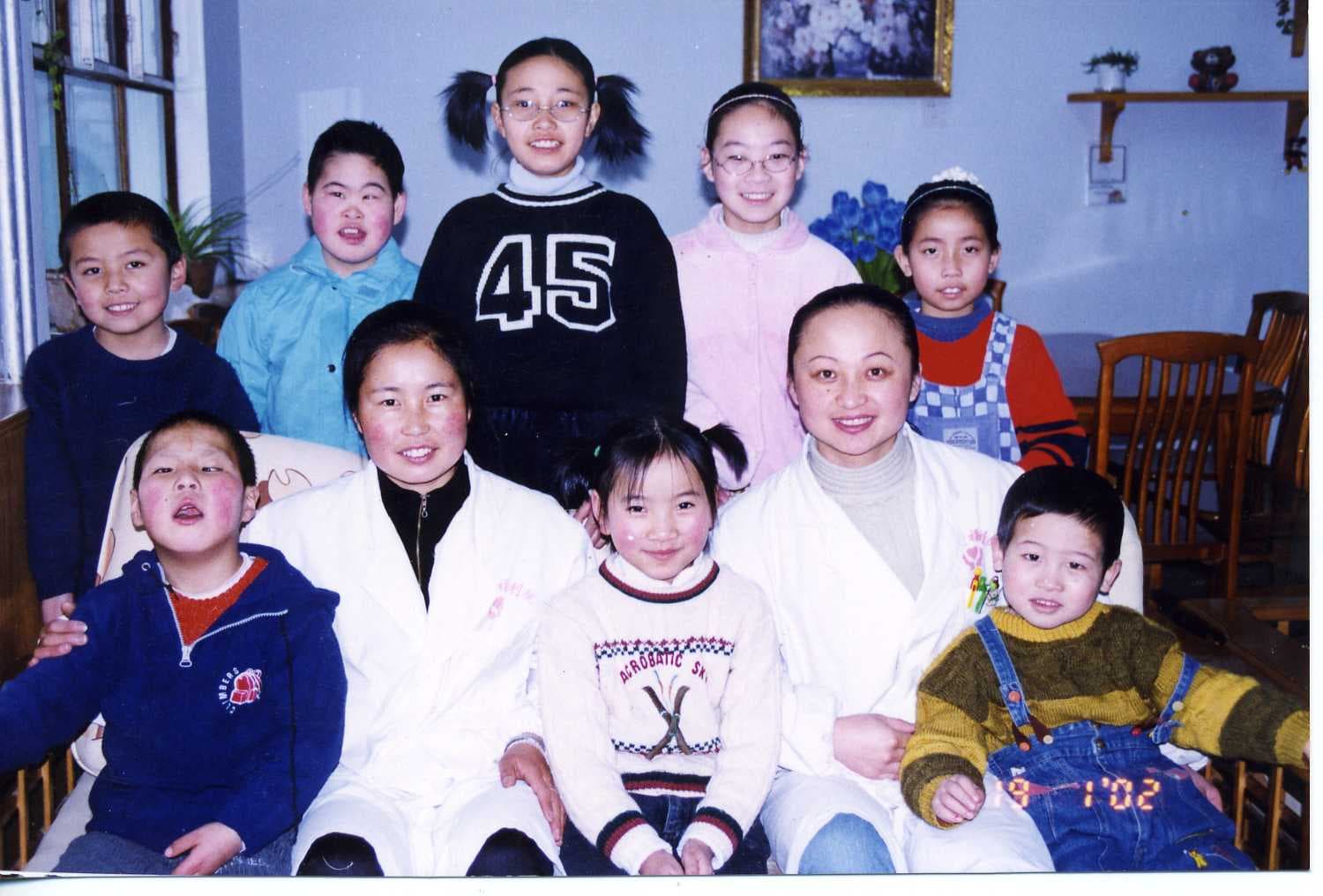 Bingjie Turner and Abigail Anderson at the Xining Children's Home (2002)