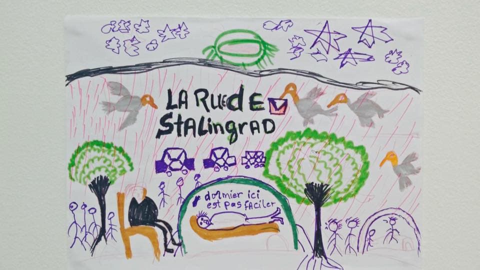 A child's drawing of a kid sleeping in a small tent on a Paris street with the words 