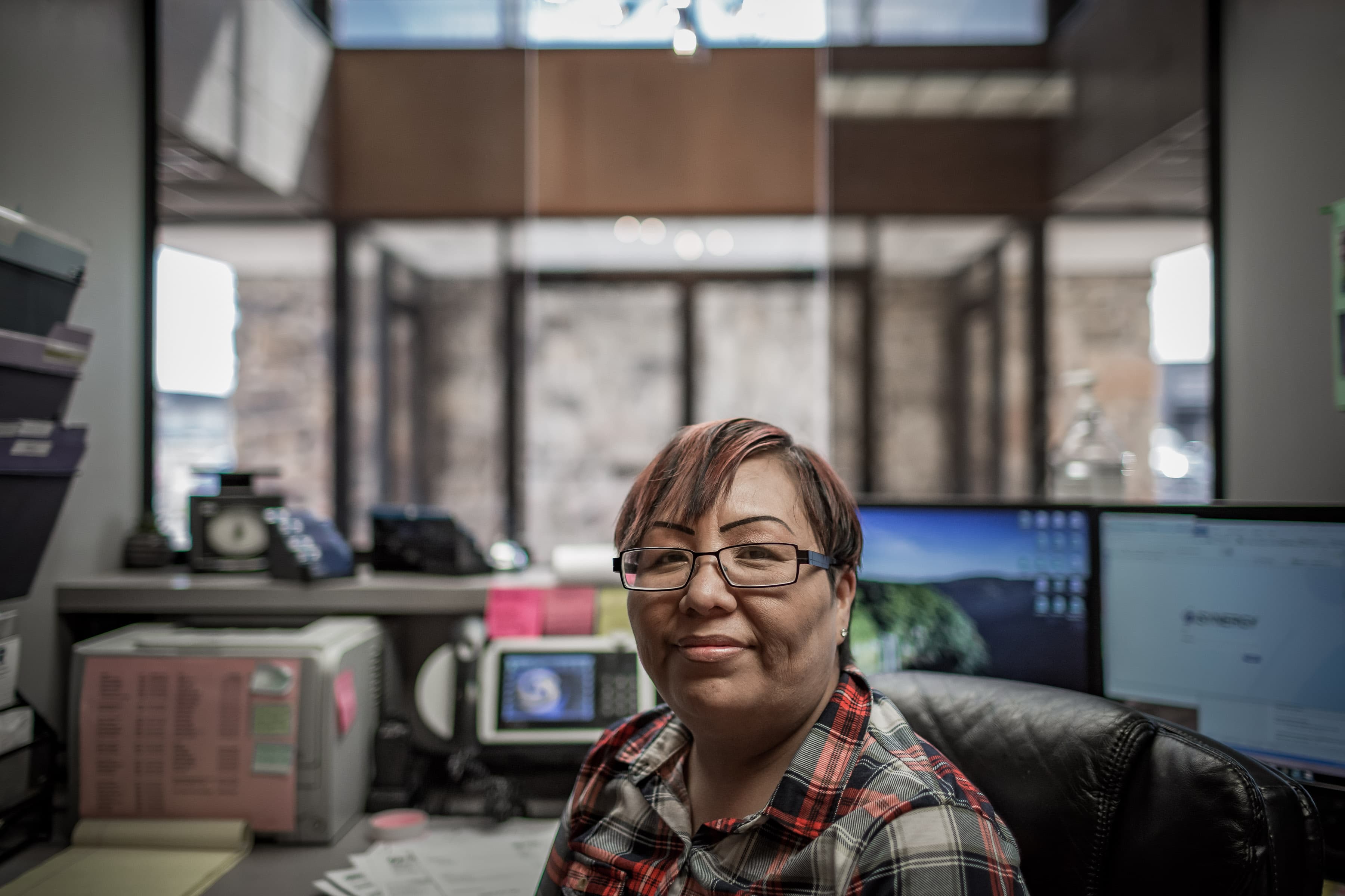 A woman behind a desk