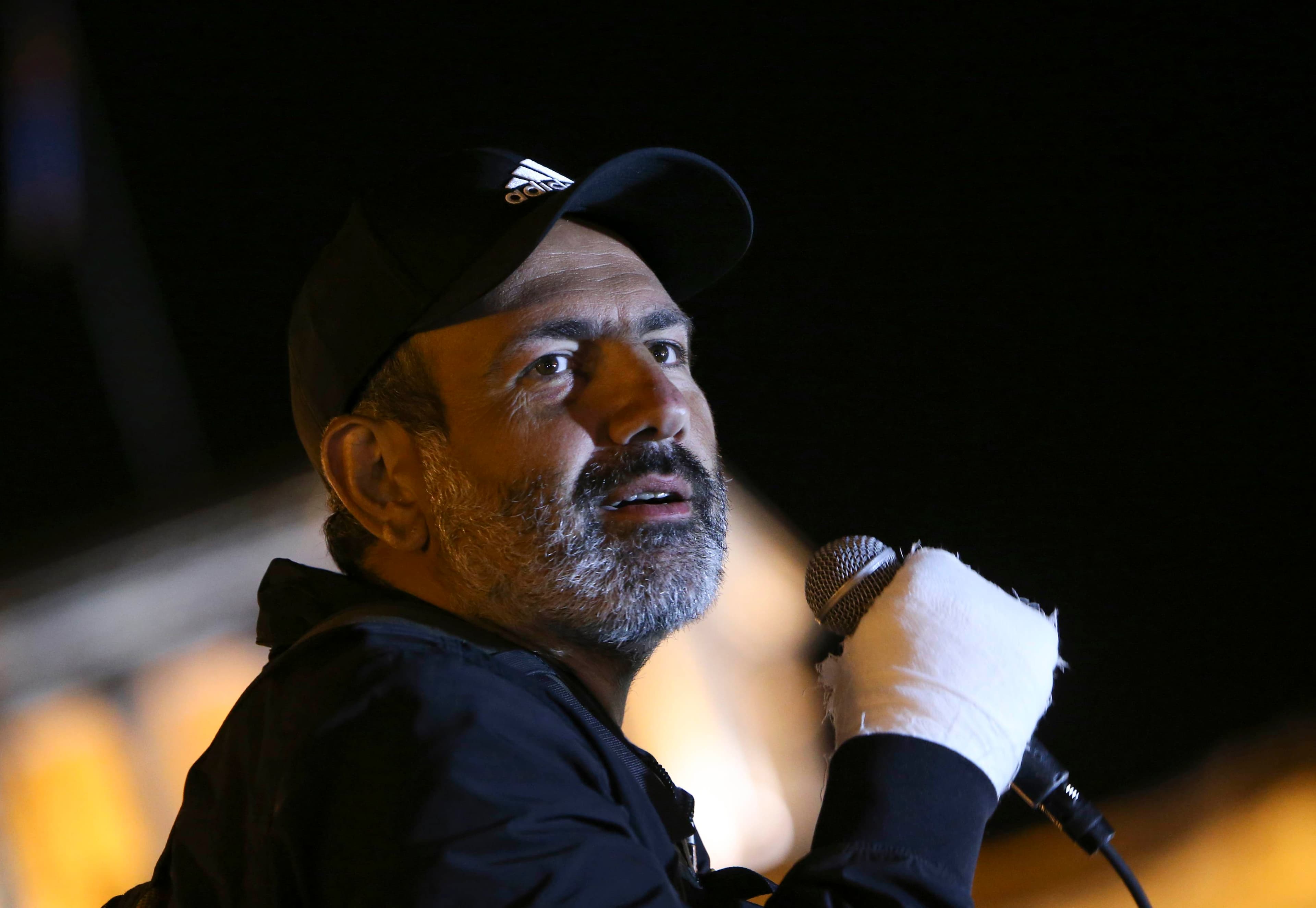A close-up photograph of Armenian opposition leader Nikol Pashinyan delivering a speech.