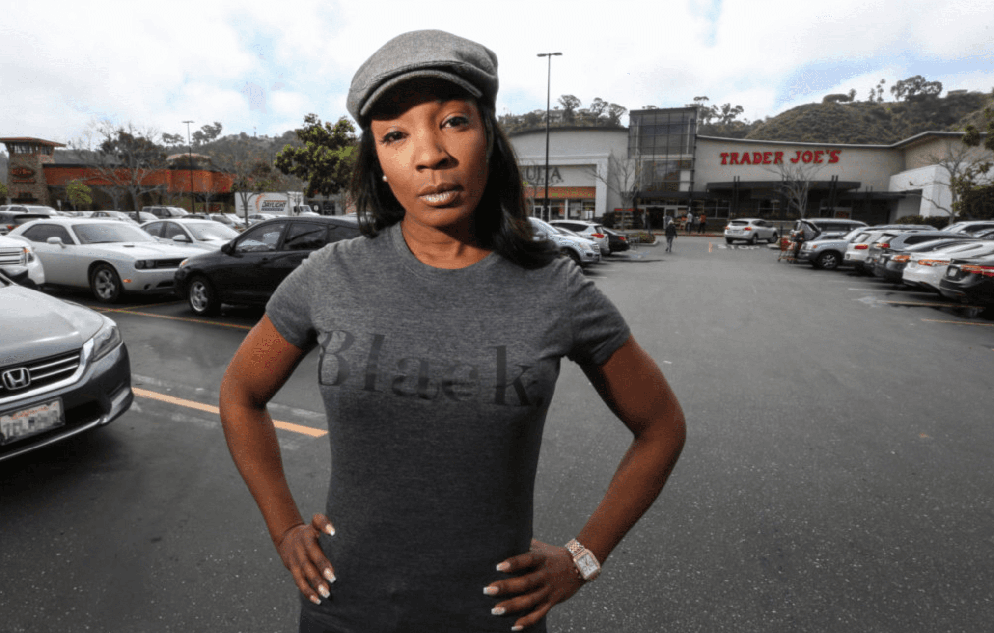 A woman standng in a parking lot