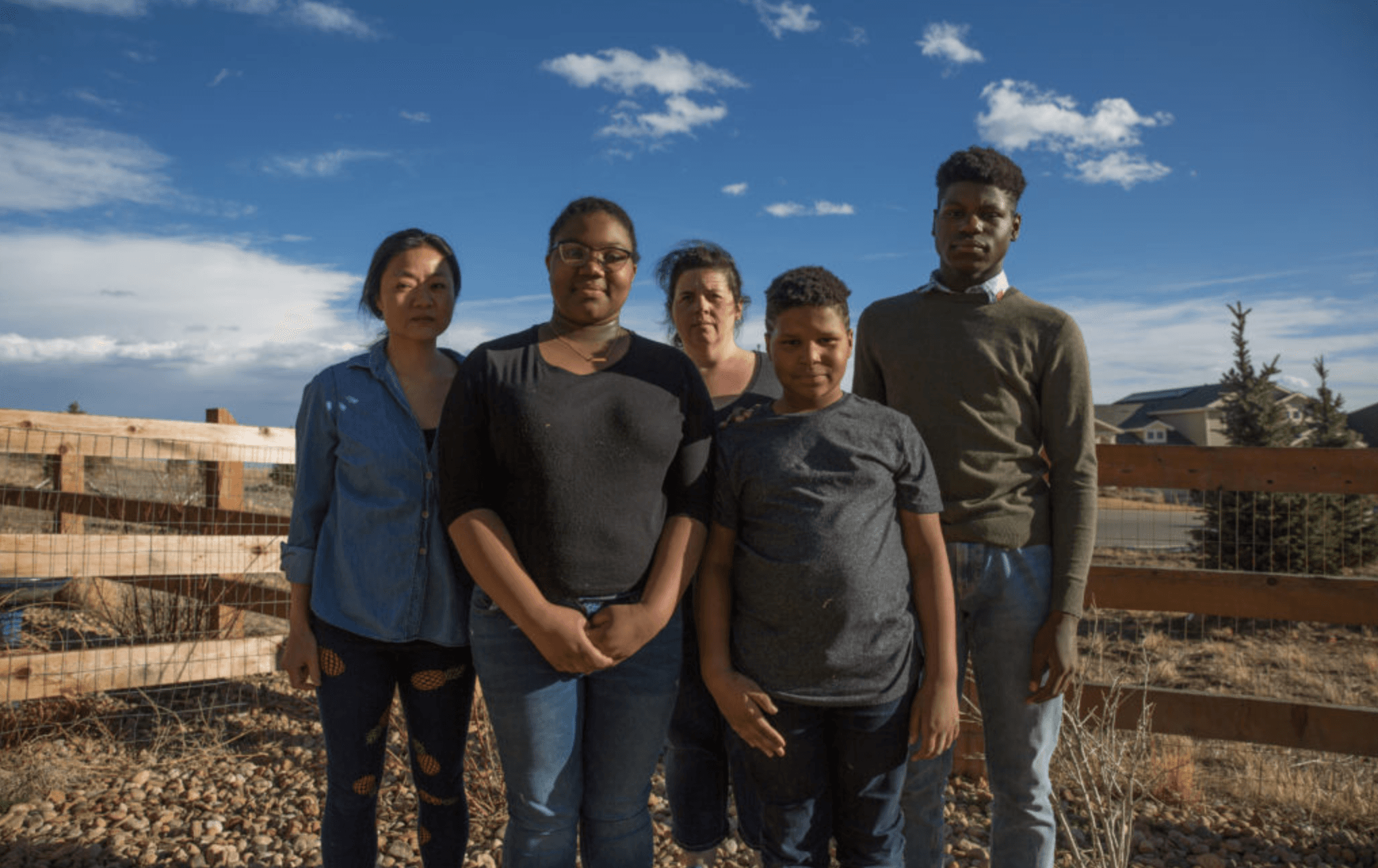 A family stands outside