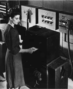 Frances Bilas Spence feeding punch cards into ENIAC, Feb 1946.