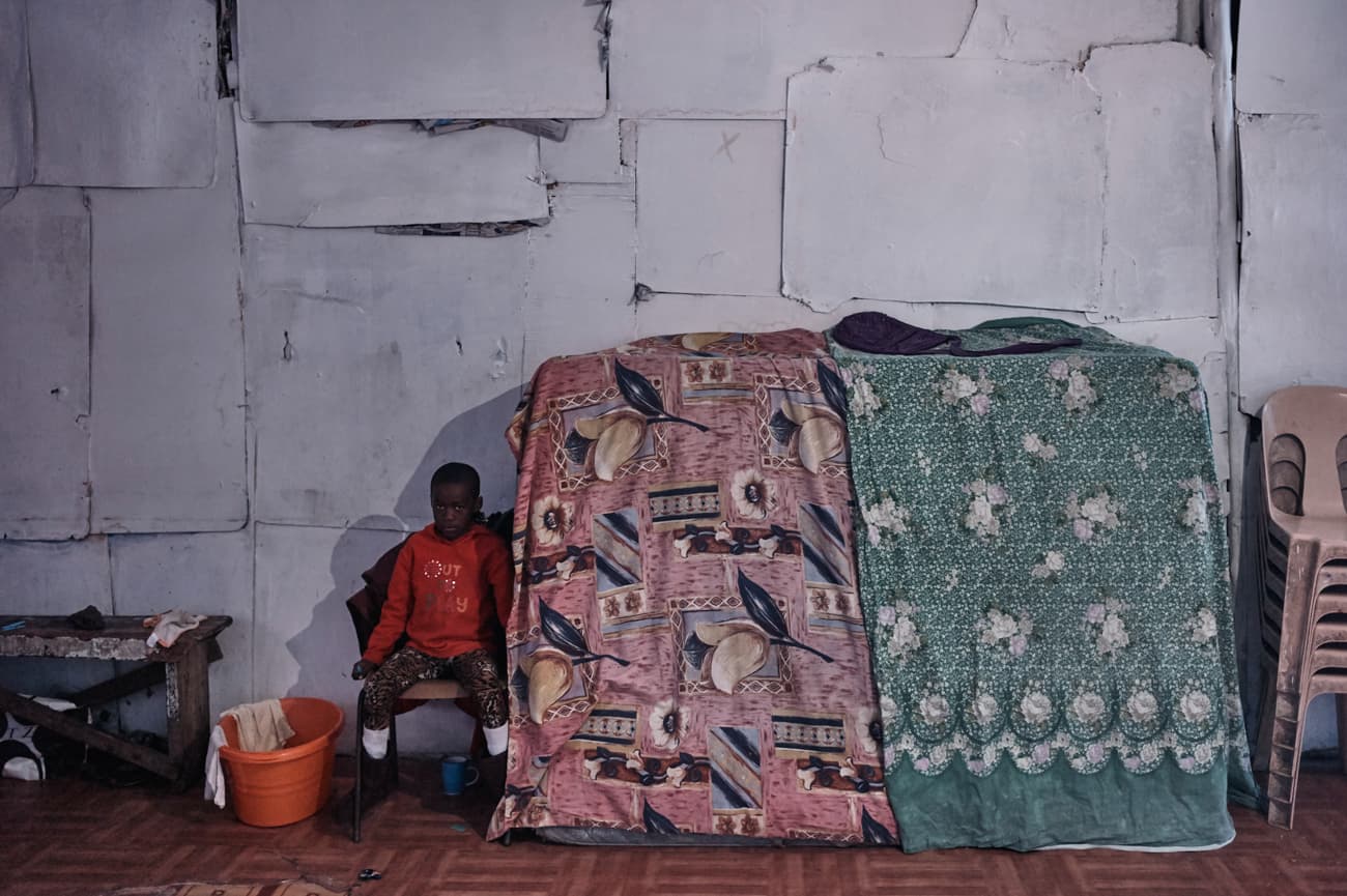 Likhanyise, 6, poses for a photograph at the same spot in a church where his grandmother Fundiswa was phototgraphed three years ago. Fundiswa died in September 2013.