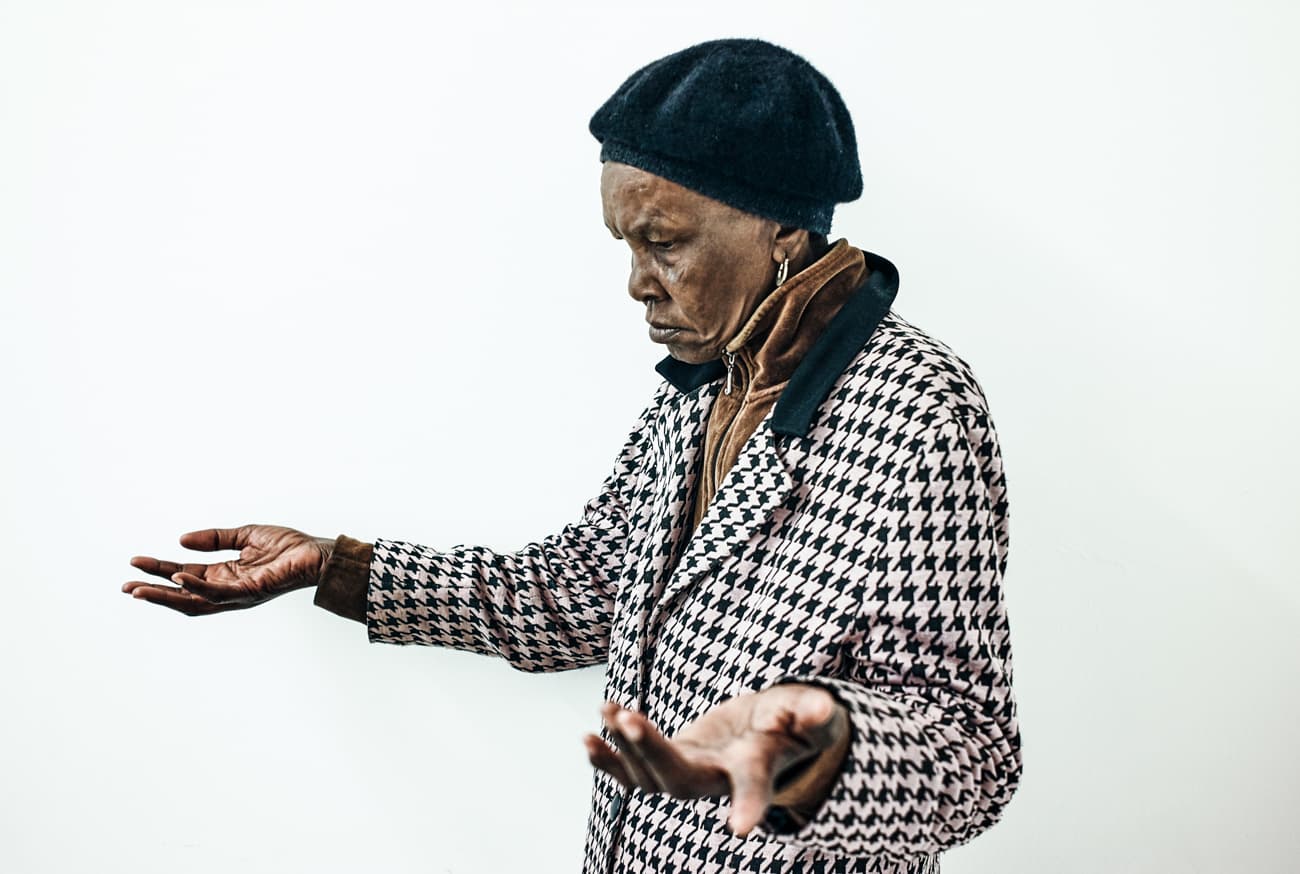 Orianda reflects on how she felt when she found out about being diagnosed with HIV and tuberculosis in this photograph taken in 2013, Gugulethu, Cape Town.