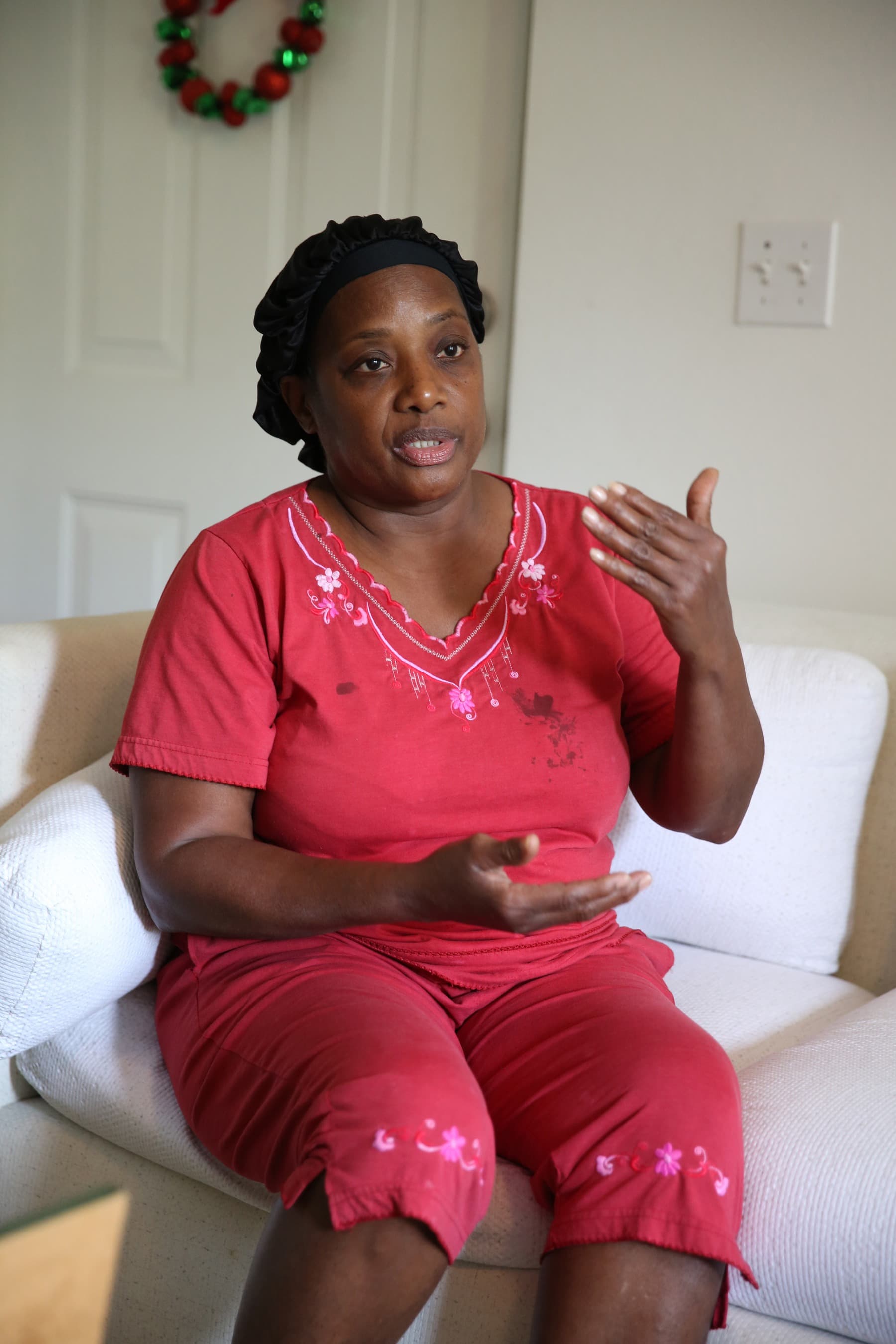 Cynthia Louis during a home visit from Nicole Neufeld, a social work student from Florida International University.