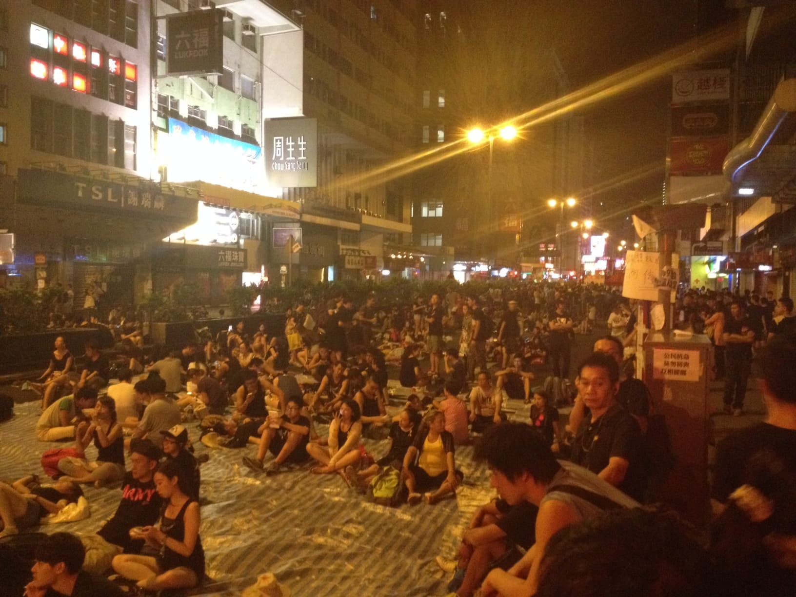 Protestors gather in Mong Kok. The spontaneous gathering has morphed into something of a utopian forum. There's a stage where people can voice their opinion, debate circles and volunteers handing out 