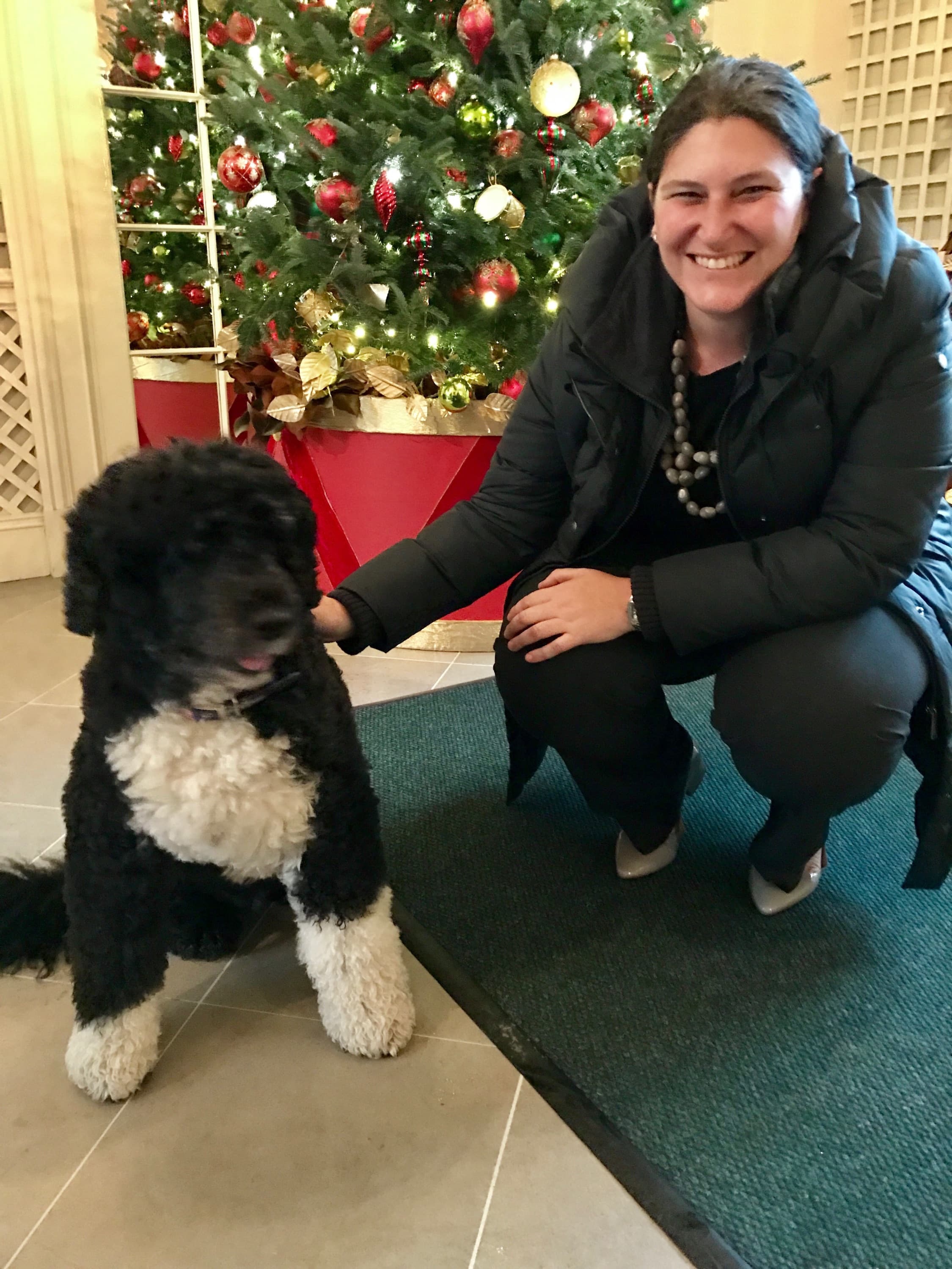 Gabriela Chojkier, Senior Director of Hispanic Media at the White House with Obama's dog Bo.