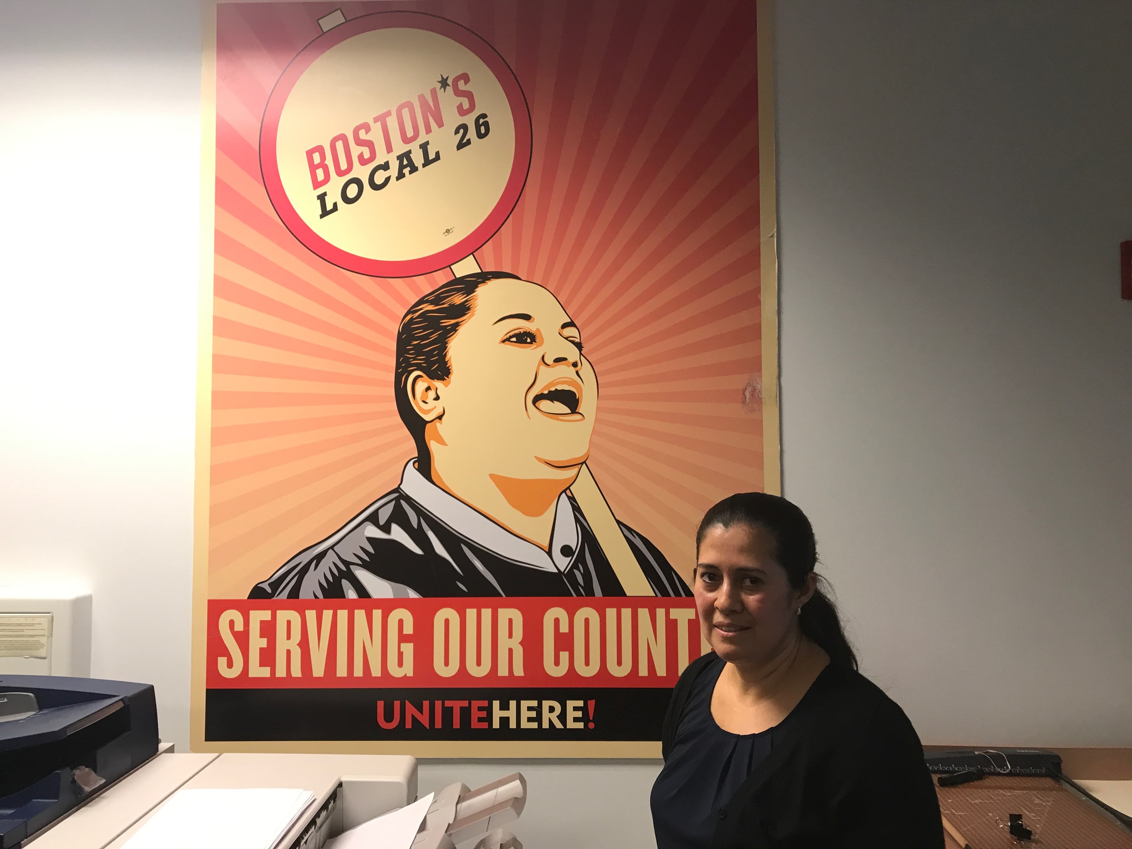 Woman standing in front of poster