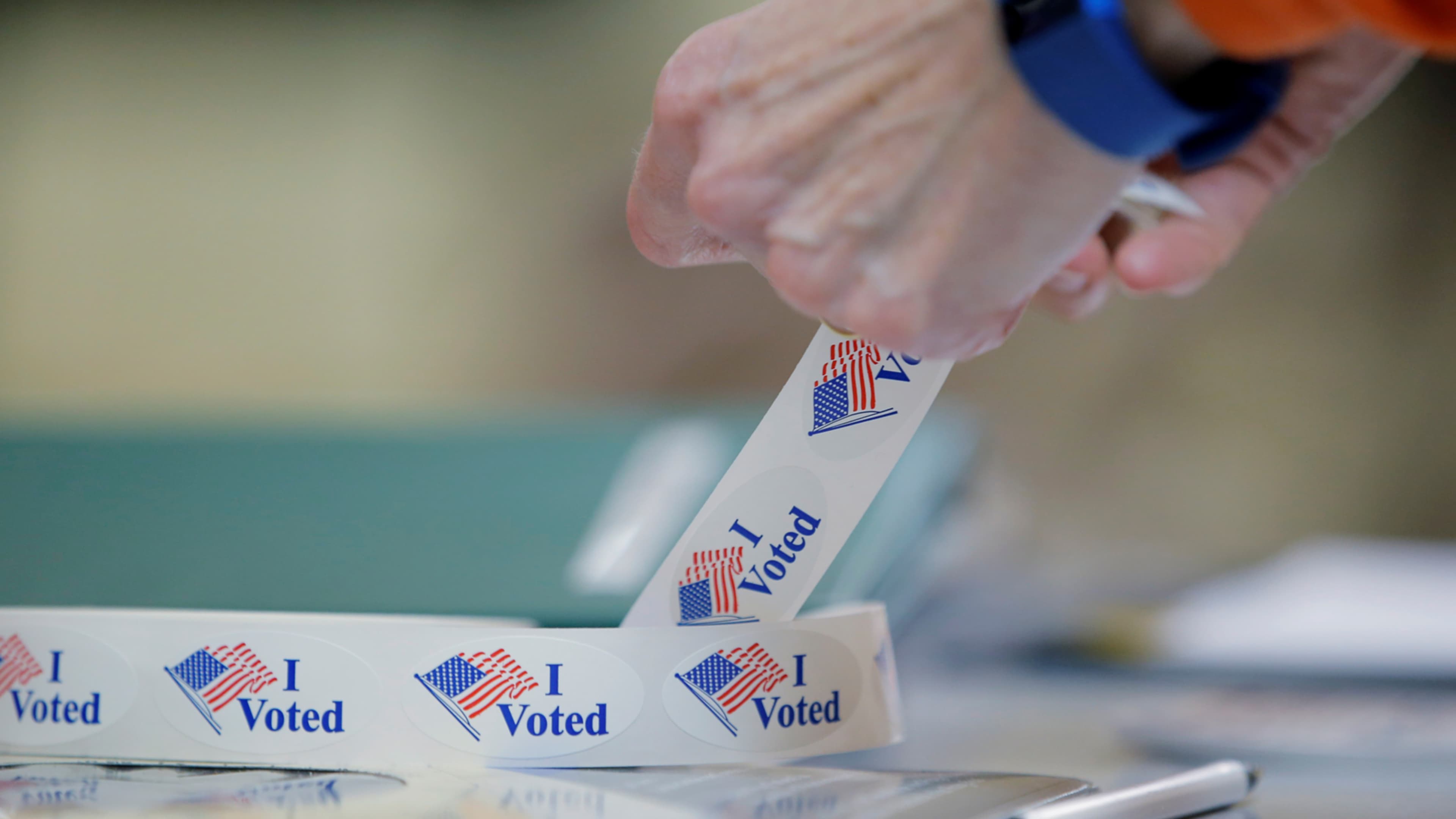 FILE PHOTO: A voter peels off an "I Voted" sticker after voting in North Carolina's U.S. presidential primary election at Sharon Presbyterian Church in Charlotte, North Carolina, U.S. on March 15, 2016. REUTERS/Chris Keane/File Photo