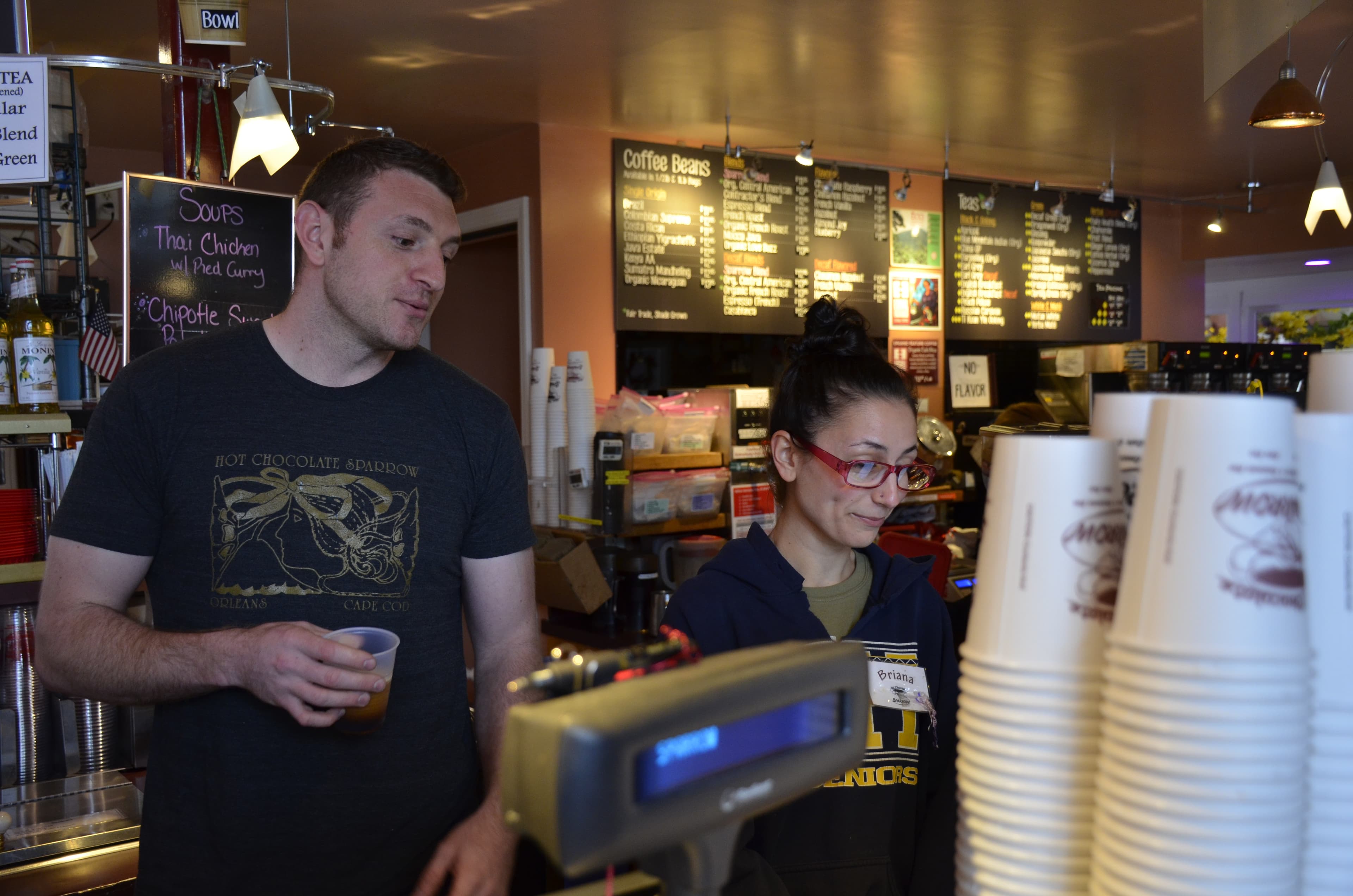 Perry Sparrow (left) and his employee Briana Trafuoci behind the counter at the Hot Chocolate Sparrow. In part due to the high cost of housing on the Cape, Sparrow says there’s not enough local seasonal workers to hire.
